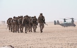 CAMP GERBER, Kuwait (Sept. 27, 2021) Marines assigned to the11th Marine Expeditionary Unit (MEU), disembark from an MV-22B Osprey attached to Marine Medium Tiltrotor Squadron (VMM) 165 (Reinforced), during sustainment training at Camp Gerber, Kuwait, Sept. 27. The Essex Amphibious Ready Group and the 11th MEU are deployed to the U.S. 5th Fleet area of operations in support of naval operations to ensure maritime stability and security in the Central Region, connecting the Mediterranean and Pacific through the Western Indian Ocean and three strategic choke points. (U.S. Marine Corps photo by Cpl. Sgt. Jennessa Davey)