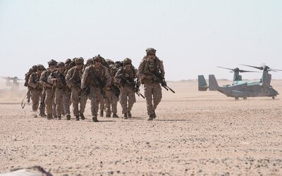 CAMP GERBER, Kuwait (Sept. 27, 2021) Marines assigned to the11th Marine Expeditionary Unit (MEU), disembark from an MV-22B Osprey attached to Marine Medium Tiltrotor Squadron (VMM) 165 (Reinforced), during sustainment training at Camp Gerber, Kuwait, Sept. 27. The Essex Amphibious Ready Group and the 11th MEU are deployed to the U.S. 5th Fleet area of operations in support of naval operations to ensure maritime stability and security in the Central Region, connecting the Mediterranean and Pacific through the Western Indian Ocean and three strategic choke points. (U.S. Marine Corps photo by Cpl. Sgt. Jennessa Davey)