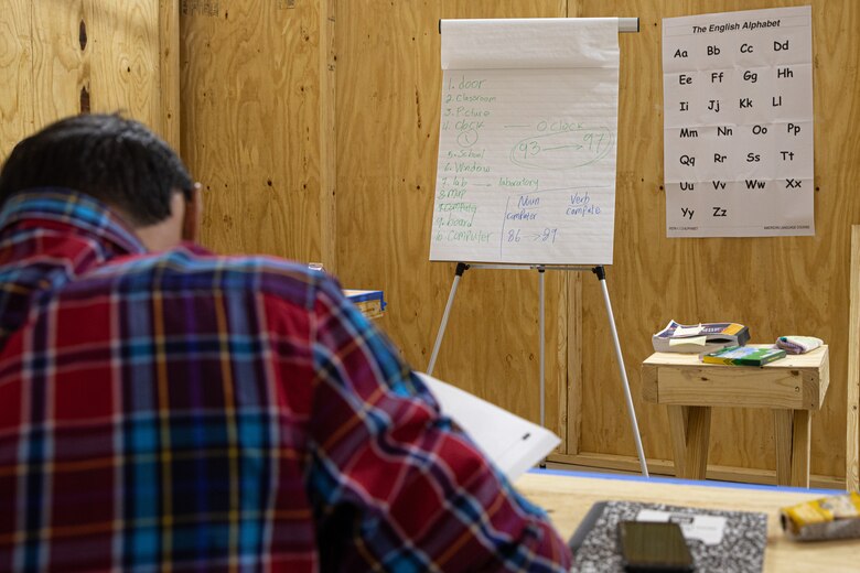 An Afghan evacuee attends school to learn English on Holloman Air Force Base, New Mexico, Sept. 28, 2021. The Department of Defense, through the U.S. Northern Command, and in support of the Department of State and Department of Homeland Security, is providing transportation, temporary housing, medical screening, and general support for at least 50,000 Afghan evacuees at suitable facilities, in permanent or temporary structures, as quickly as possible. This initiative provides Afghan evacuees essential support at secure locations outside Afghanistan. (U.S. Army photo by Spc. Nicholas Goodman)