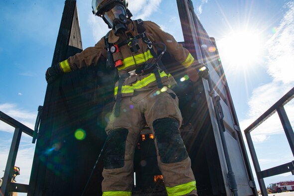 Firefighters from Task Force-Holloman train with members of the 49th Civil Engineer Squadron in a live-fire exercise Sept. 23, 2021 on Holloman Air Force Base, New Mexico. The training ensures TF-H members remain ready and improves interoperability in the event that a fire breaks out in Aman Omid Village. The Department of Defense, through U.S. Northern Command, and in support of the Department of State and Department of Homeland Security, is providing transportation, temporary housing, medical screening, and general support for at least 50,000 Afghan evacuees at suitable facilities, in permanent or temporary structures, as quickly as possible. This initiative provides Afghan evacuees essential support at secure locations outside Afghanistan. (U.S. Air Force photo by Staff Sgt. Kenneth Boyton)