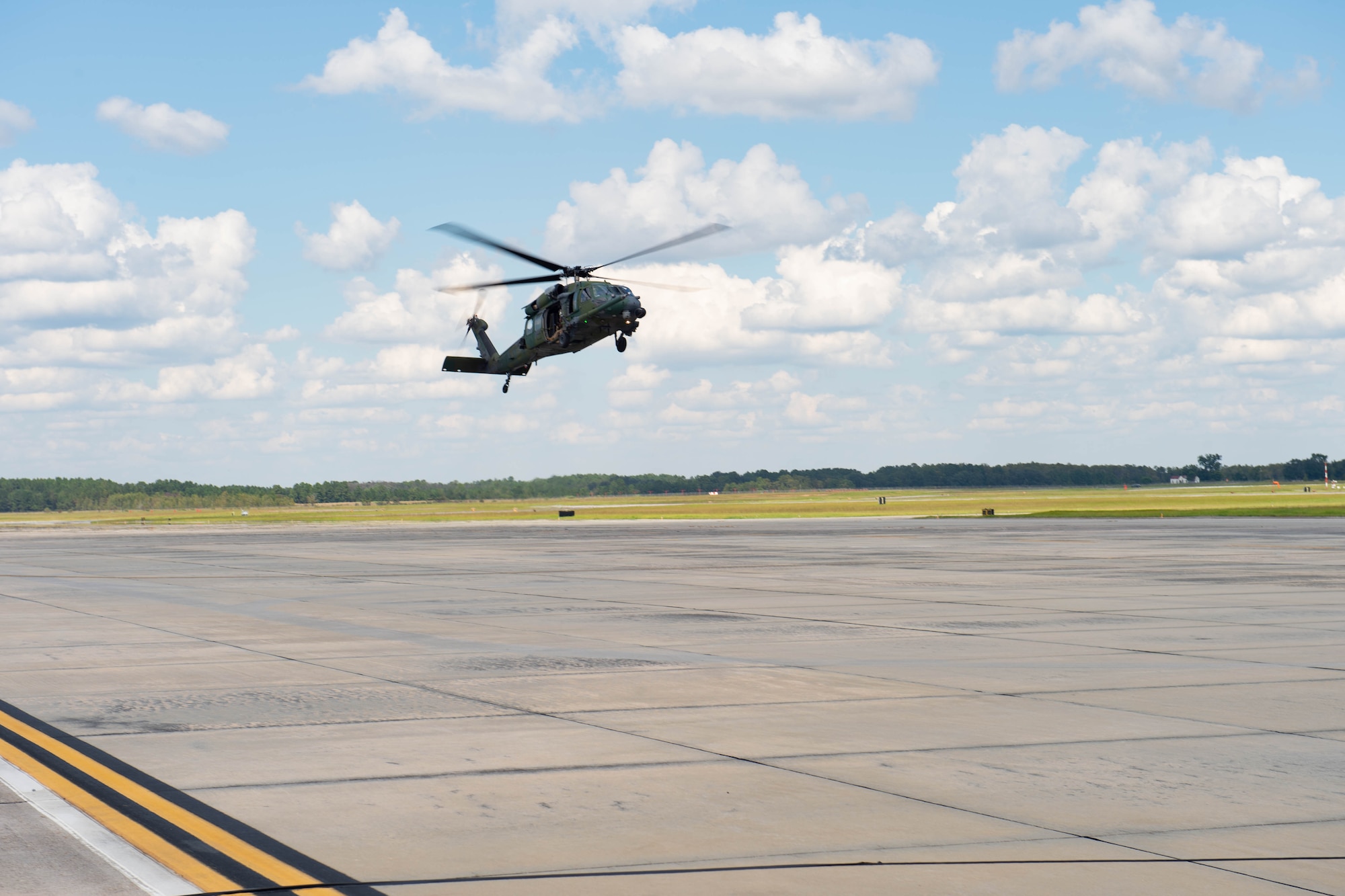 A photo of a helicopter flying.