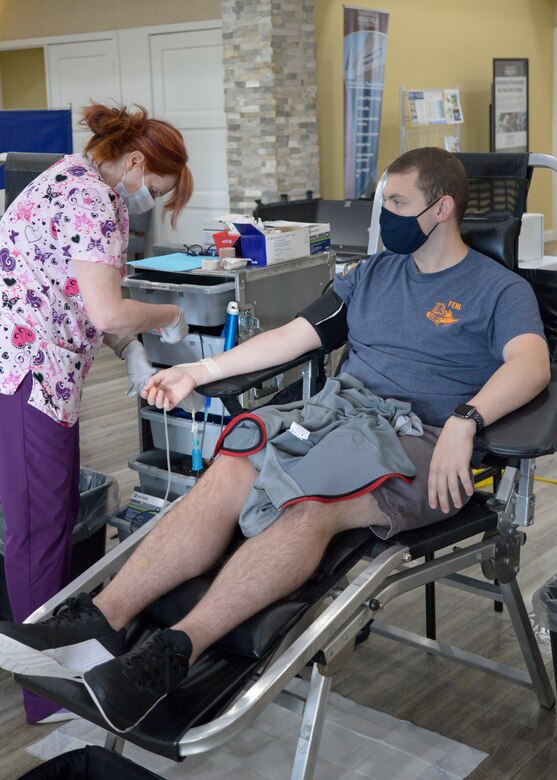 Second Lt. Dylan Hazlett, Air Force Institute of Technology, donates blood Sept. 23 during a drive at Wright-Patterson Air Force Base. The Armed Services Blood Program mission is to provide blood and blood products to U.S. armed forces needed on the battlefield, as well as in military treatment facilities worldwide. (U.S. Air Force photo by Senior Airman Emily Rupert)