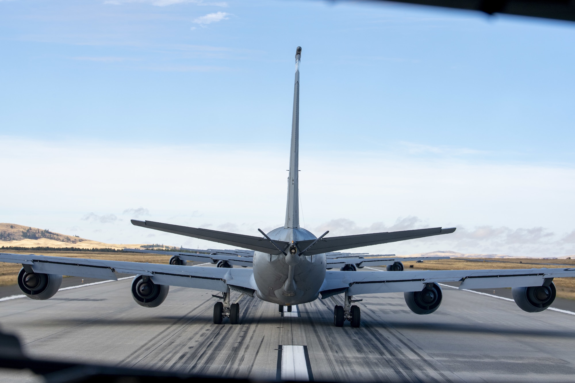 Multiple KC-135 Stratotankers perform an elephant walk as part of a 20-aircraft minimal interval takeoff exercise at Fairchild Air Force Base, Washington, Sept. 29, 2021.