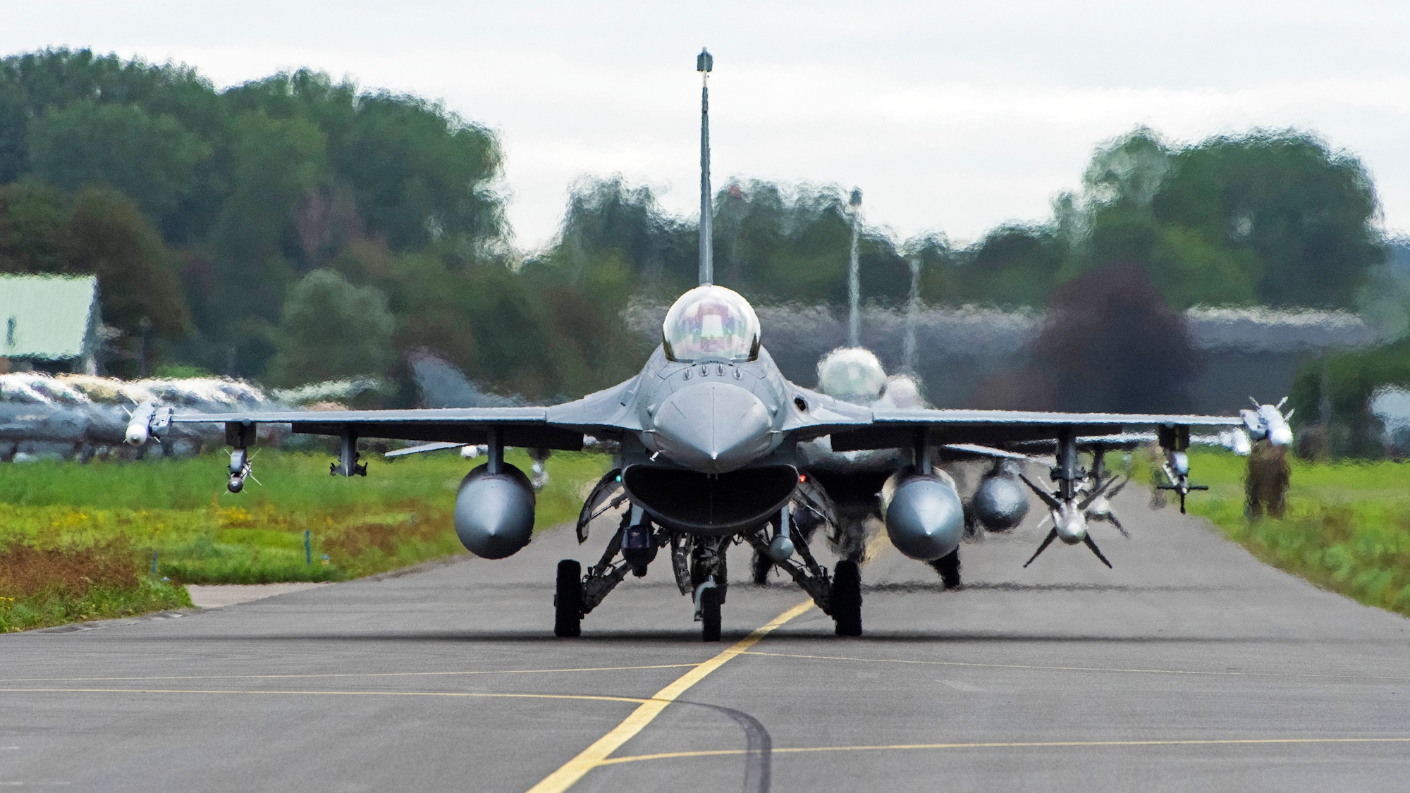 U.S. Air Force F-16 Fighting Falcons assigned to the 480th Fighter Squadron, from Spangdahlem Air Base, Germany, taxi at Leeuwarden Air Base, Netherlands, Sept. 13, 2021. They integrated with coalition F-16 Fighting Falcon and F-35 Lightning II fighter aircraft during the Suppression of Enemy Air Defense phase of a weapons instructor course that also included aircraft from Belgium, the Netherlands and Norway. (U.S. Air Force photo by Tech. Sgt. Anthony Plyler)