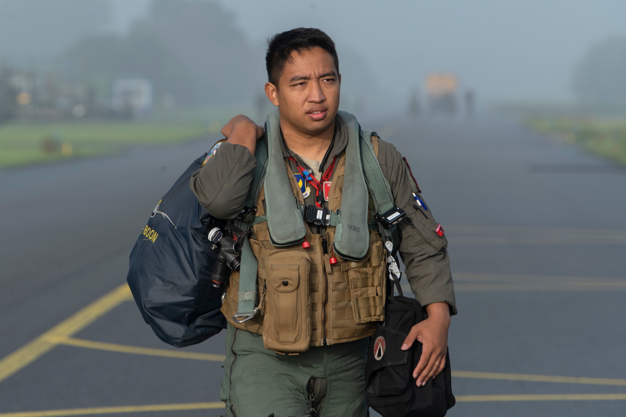 U.S. Air Force 1st Lt. Pittayut Phonboon, 480th Fighter Squadron pilot from Spangdahlem Air Base, Germany, steps to a U.S. Air Force F-16 Fighting Falcon at Leeuwarden Air Base, Netherlands, Sept. 15, 2021. 480th FS pilots participated in the Suppression of Enemy Air Defense phase of the weapons instructor course that also included pilots from Belgium, the Netherlands and Norway. (U.S. Air Force photo by Tech. Sgt. Anthony Plyler)