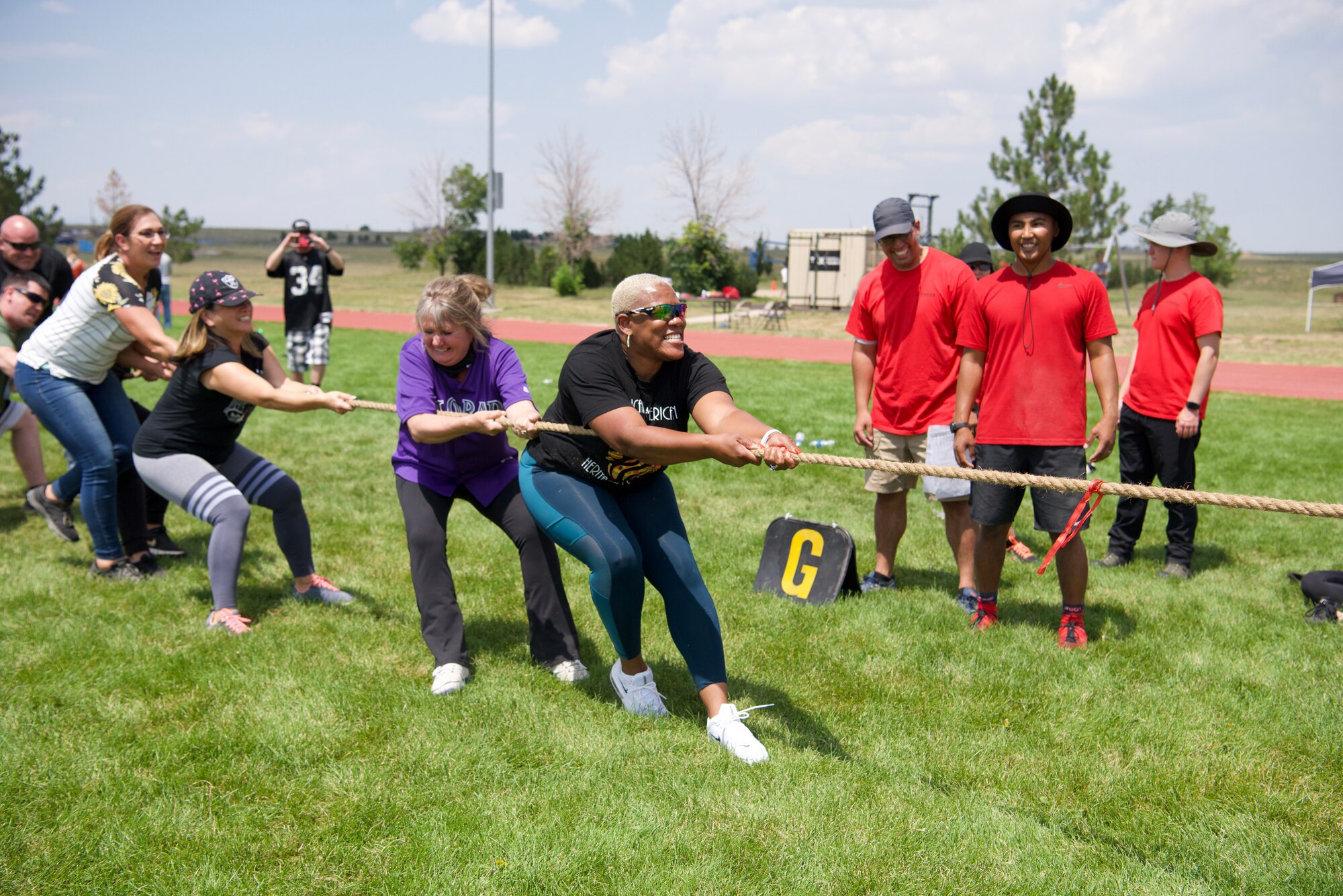 The 50th Force Support Squadron Airmen and Family Readiness Team put up a good fight in a tug of war event at the Aug. 6, 2021, Olympics-themed Wingman Day at Schriever Space Force Base, Colorado. Tug of war, as a sport, was included in six Olympic Games from 1900 until 1920.  (U.S. Space Force photo by Kristian DePue)