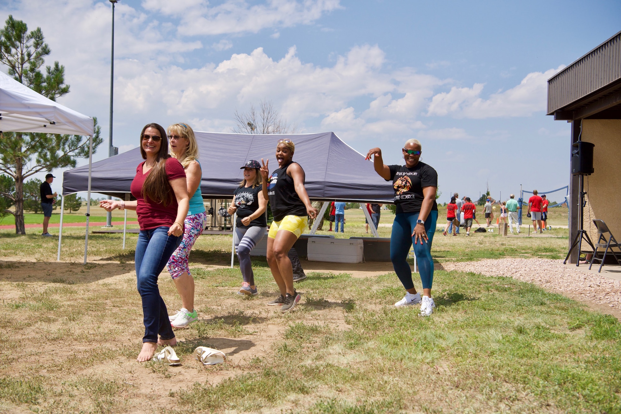 Members of Schriever Space Force Base, Colorado, dance to the “Electric Slide” during the biannual Wingman Day, Aug. 6, 2021. The event was designed to get Vitamin D, increase dopamine and foster a spirit of fellowship. (U.S. Space Force Photo by Kristian DePue)