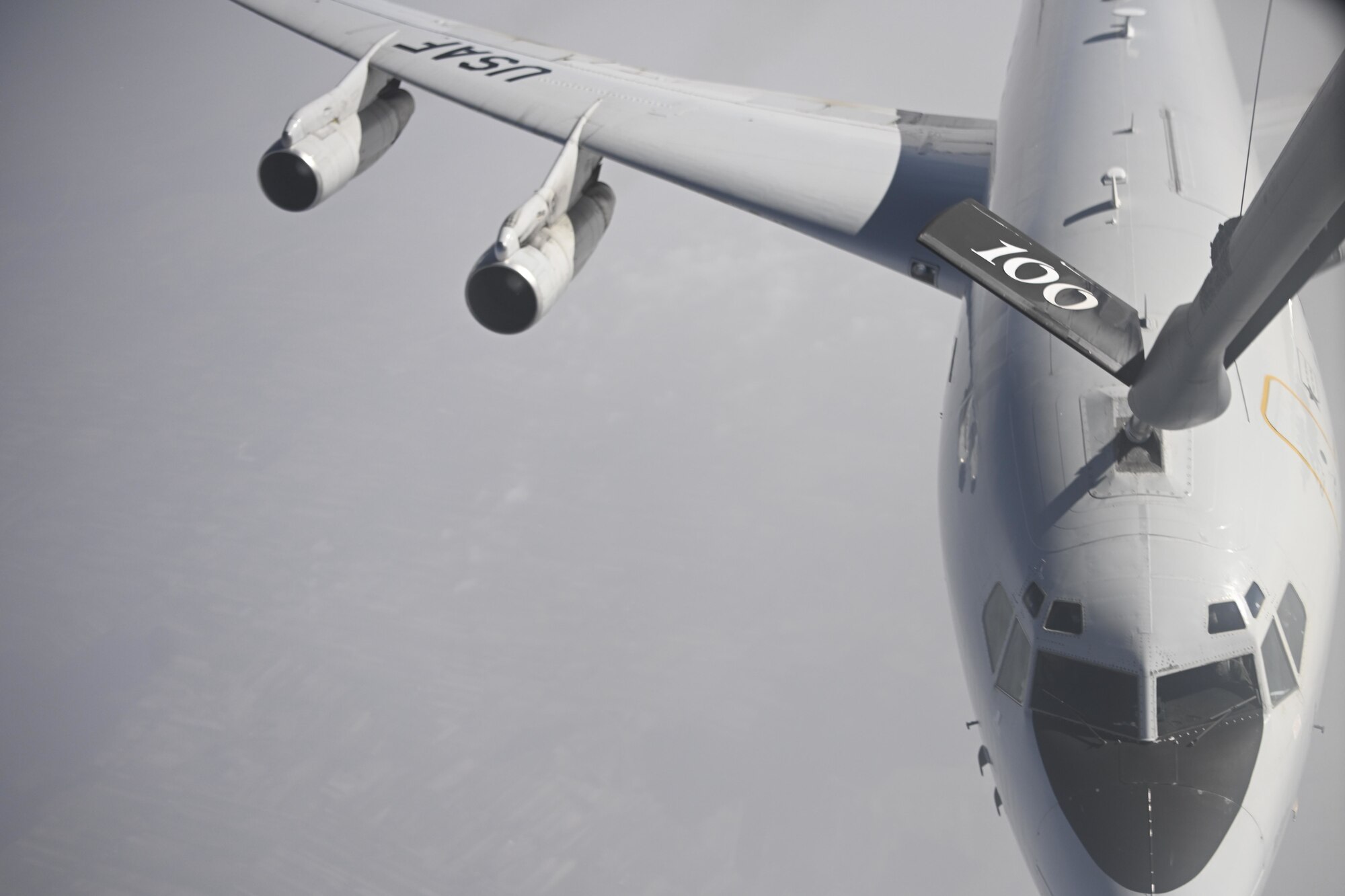 A U.S. Air Force KC-135 Stratotanker aircraft assigned to the 100th Air Refueling Wing, Royal Air Force Mildenhall, England, delivers fuel to an E-8C Joint STARS aircraft over Poland, March 30, 2022. The 100th ARW supports the U.S. Air Force's global reach mission by extending the range of aircraft in Europe and Africa. (U.S. Air Force photo by Senior Airman Joseph Barron)