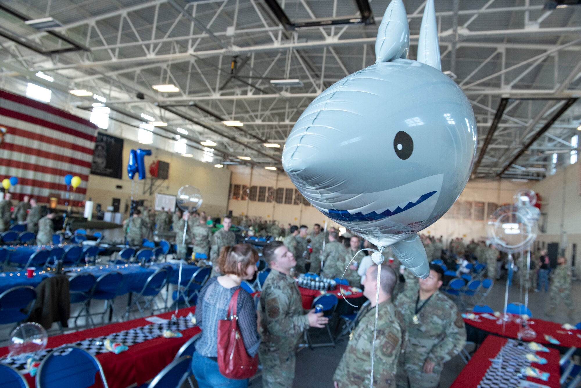 A shark balloon representing the 75th Fighter Squadron Tiger Sharks floats above attendees at the Maintenance Professional of the Year awards banquet at Moody Air Force Base, Georgia, March 25, 2022. During MPOY, Airmen from all of Team Moody’s maintenance squadrons compete to earn awards in various categories. (U.S. Air Force photo by Senior Airman Thomas Johns)