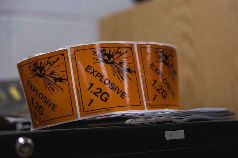 1.2 gauge explosive ordinance labels lay in the Marine Corps Air Station (MCAS) New River Station Ordinance building on MCAS New River, Jacksonville, North Carolina, March 24, 2022. Jenkins, the recipient of the March MCAS New River Go-Getter award, enlisted into the Marine Corps in 2018 from Sidney, Ohio. (U.S. Marine Corps photo by Lance Cpl. Antonino Mazzamuto)