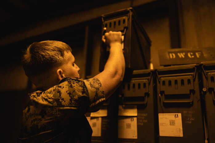 U.S. Marine Corps Cpl. Christian Jenkins, quality assurance safety observer with Headquarters and Headquarters Squadron, Marine Corps Air Station (MCAS) New River, Jacksonville, North Carolina, prepares an ordinance delivery on MCAS New River in Jacksonville, North Carolina, March 24, 2022. Jenkins, the recipient of the March MCAS New River Go-Getter award, enlisted in the Marine Corps in 2018 from Sidney, Ohio. (U.S. Marine Corps photo by Lance Cpl. Antonino Mazzamuto)