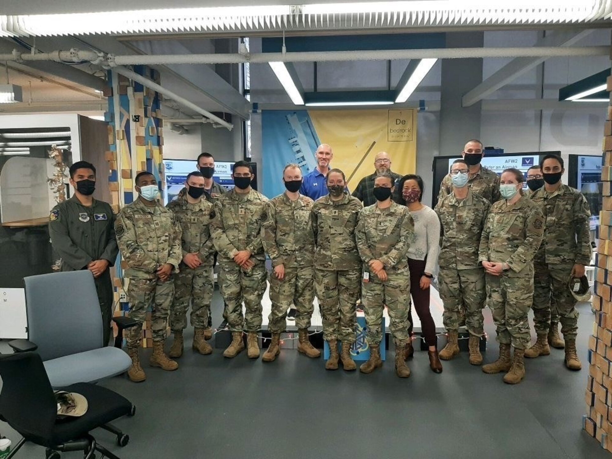 Members of the Dover Air Force Base Company Grade Officers Council pose for a photo with guest speakers following a group general meeting at the Bedrock Innovation Lab, Dec. 17, 2021. The council was named National CGOC of the year for 2021. (Courtesy photo)