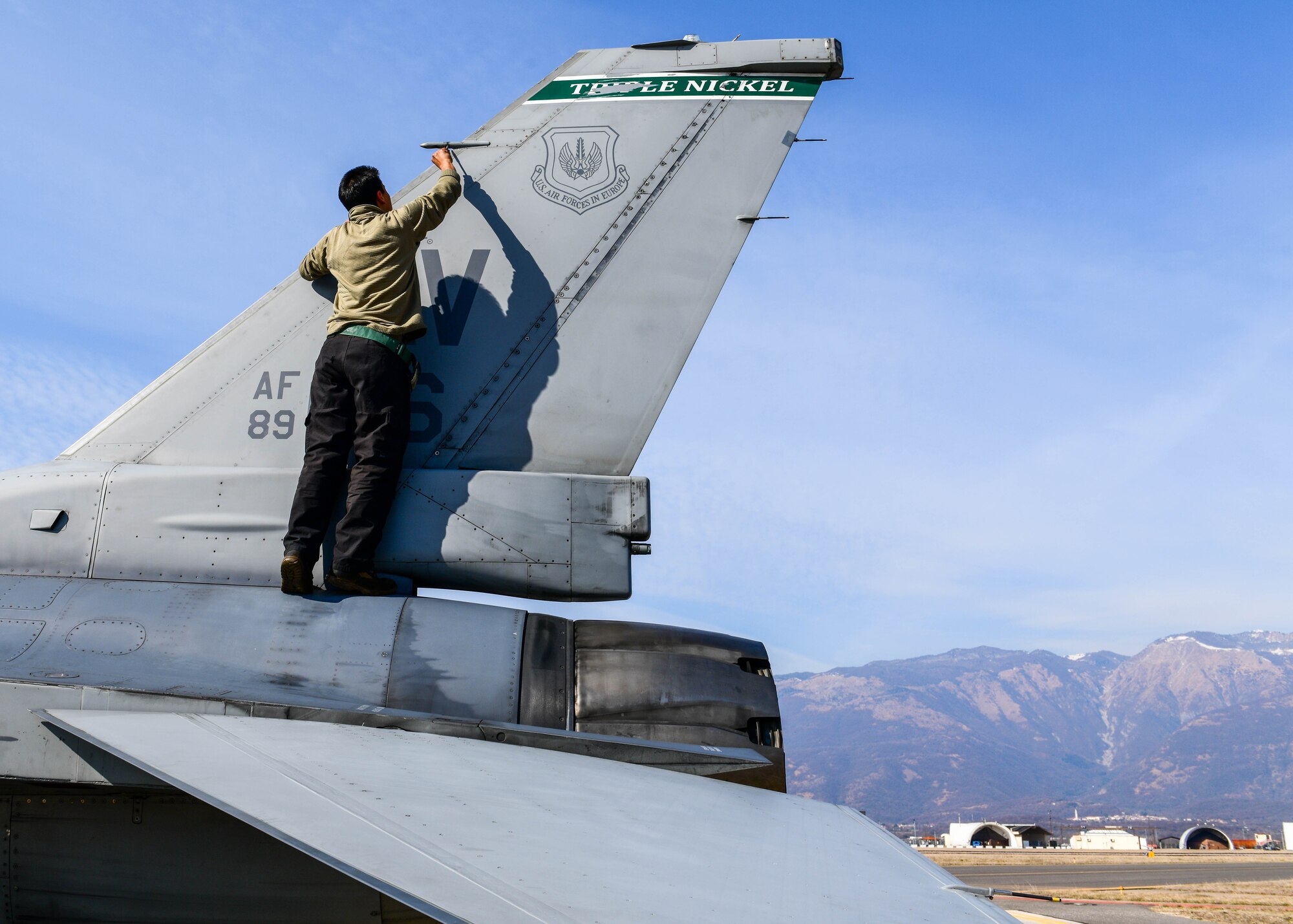 Airman 1st Class Derek Perez, 555th Aircraft Maintenance Unit F-16 Fighting Falcon crew chief, tightens screws on the tail of an F-16 assigned to the 555th Fighter Squadron at Aviano Air Base, Italy, March 2, 2022. The maintenance performed ensures continued support for NATO’s enhanced air policing mission. The 555th AMU’s operations support NATO’s statement of Alliance resolve and cohesion during enhanced air policing. (U.S. Air Force photo by Senior Airman Brooke Moeder)
