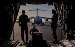 U.S. Air Force Senior Master Sgt. Chuck Davis, left, and Airman 1st Class Skye Luck, Nevada Air National Guard loadmasters, at the ramp of a Nevada C-130 Hercules Aircraft after completing a training mission at Hickam Air Force Base, Hawaii, March 2, 2022. Airmen from various squadrons and groups from the Nevada Air National Guard participated in an exercise to employ the agile combat employment concept across various Hawaiian Islands.