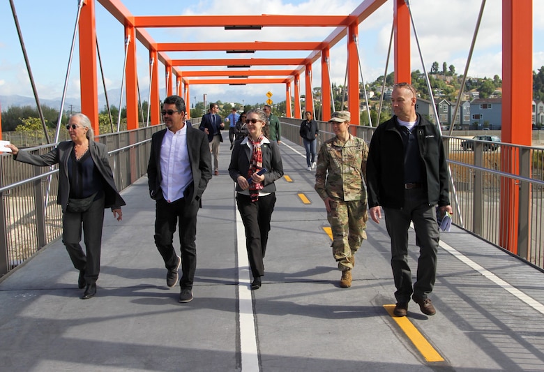 Deborah Weintraub, left, chief deputy city engineer for the City of Los Angeles, leads a March 29 tour on the Taylor Yard Bridge to give pertinent views of the LA River for Assistant Secretary of the Army (Civil Works) Michael Connor, second from left, and Maj. Gen. William Graham, right, U.S. Army Corps of Engineers deputy commanding general for Civil and Emergency Operations. Joining the senior leaders are Josephine Axt, center, chief of planning and policy for the Corps of Engineers' South Pacific Division; Julie Balten, second from left, Los Angeles District commander; David Van Dorpe, background, deputy district engineer for the LA District; and others.