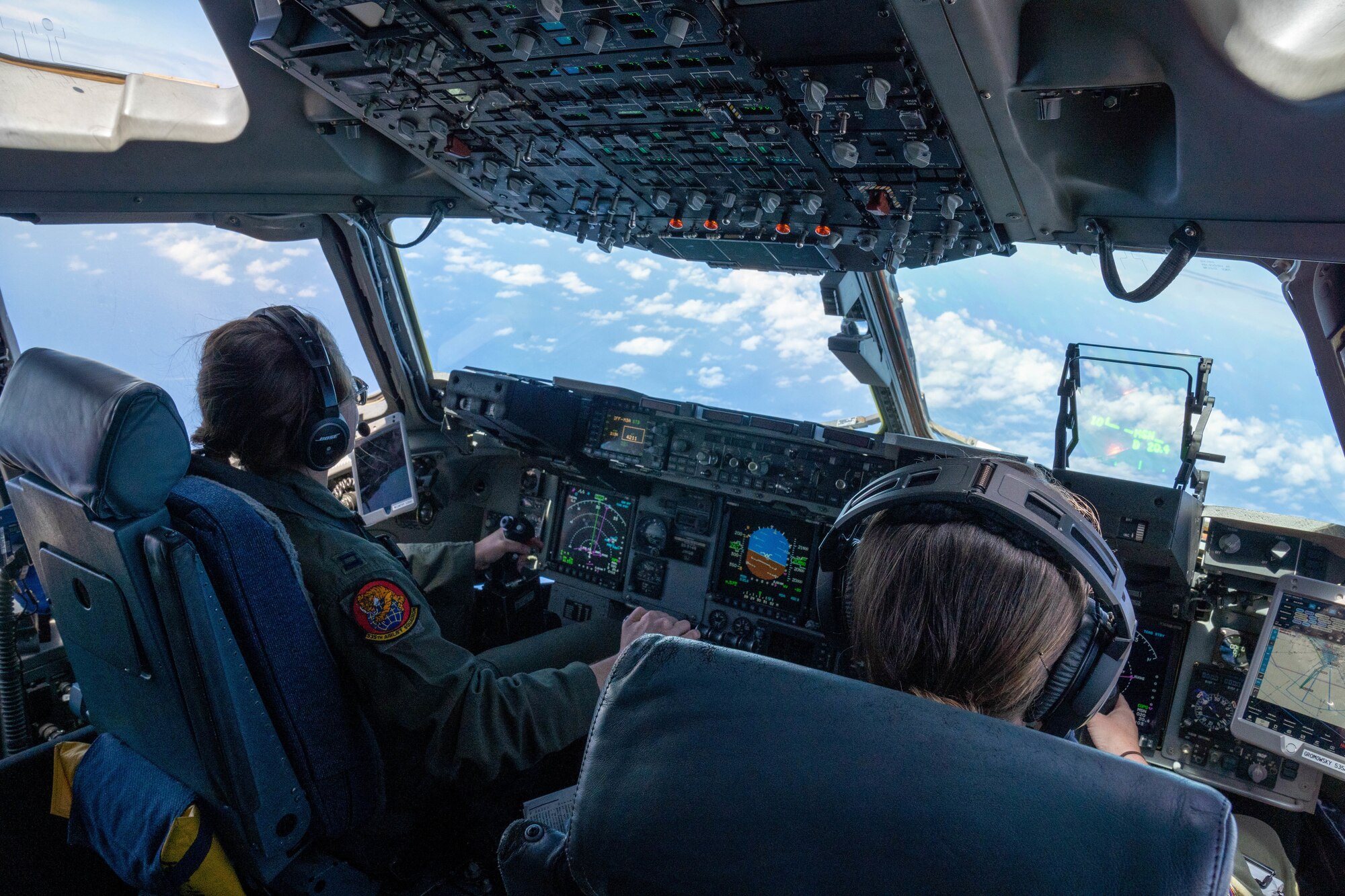 Capt. Nichole McCarthy and Maj. Abby Gromowsky, 535th Airlift Squadron pilots, complete a training mission during a Women’s History Month flight at Joint Base Pearl Harbor-Hickam, Hawaii, March 23, 2022. Women first entered pilot training in 1976 and currently make up 21 percent of the Air Force. (U.S. Air Force photo by Airman 1st Class Makensie Cooper)
