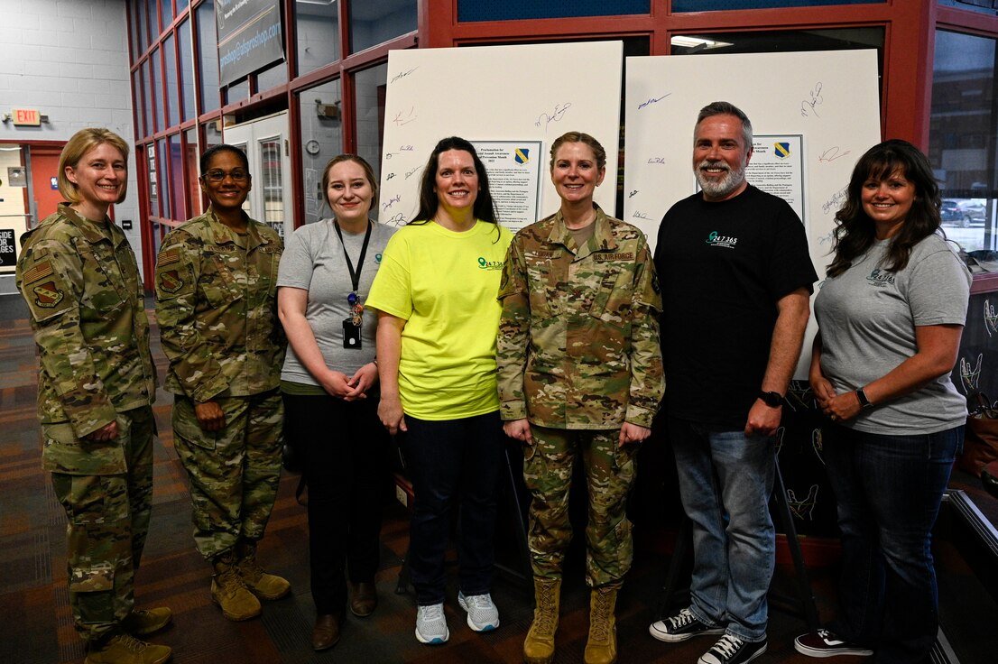 Joint Base Anacostia-Bolling Sexual Assault Prevention and Response program members and JBAB and 11th Wing command team, U.S. Air Force Col. Erica Rabe, vice commander; Col. Cat Logan, commander; and Command Chief Master Sgt. Christy Peterson pose for a photo on JBAB, Washington, D.C.