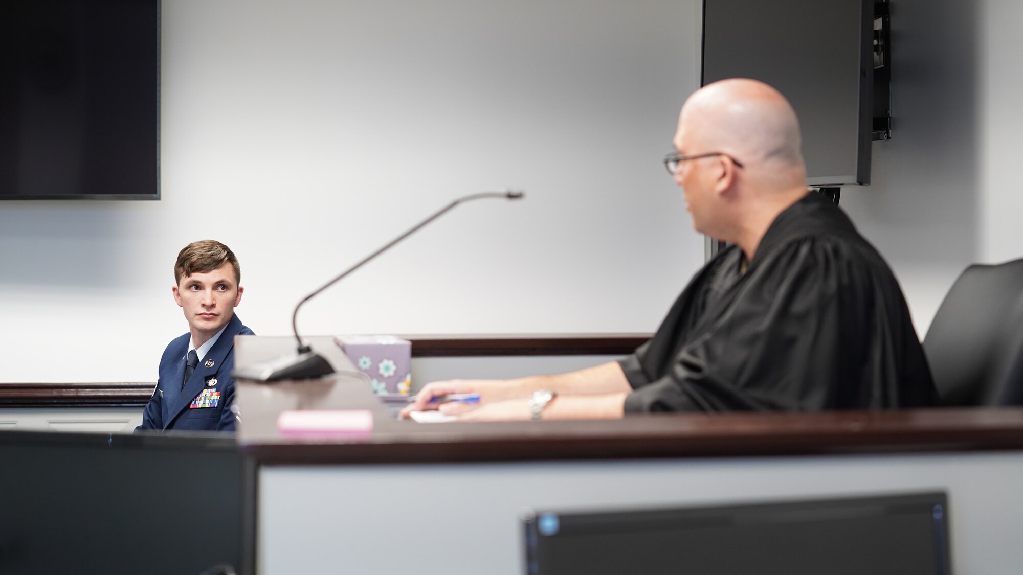 U.S. Air Force Staff Sgt. Brian Harper, 81st Security Forces Squadron member, receives feedback from a judge at a mock trial at Keesler Air Force Base, Mississippi, March 29, 2022. Harper participated in this legal training to ensure readiness should he ever be called for a court martial. (U.S. Air Force photo by Airman 1st Class Elizabeth Davis)