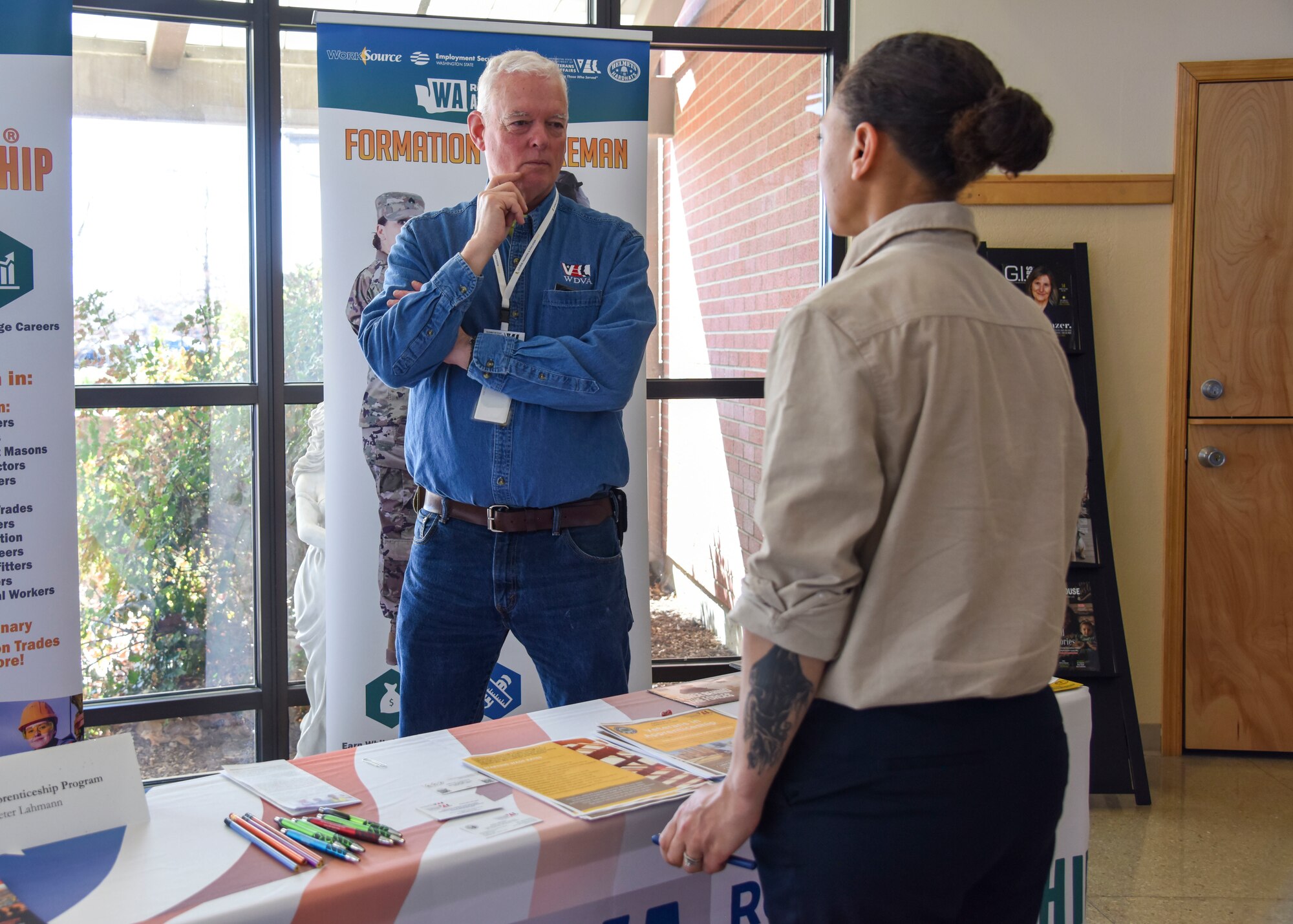 Peter Lahmann, Washington State Department of Veterans Affairs Apprenticeship program specialist, talks to a potential apprenticeship candidate at the Employment Empowerment Summit.