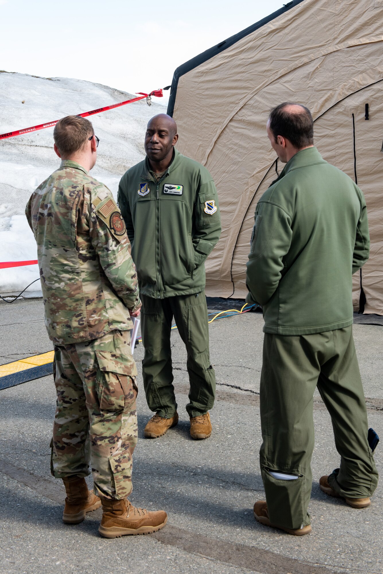 A photo of the 3rd Wing commander visiting with Airmen.