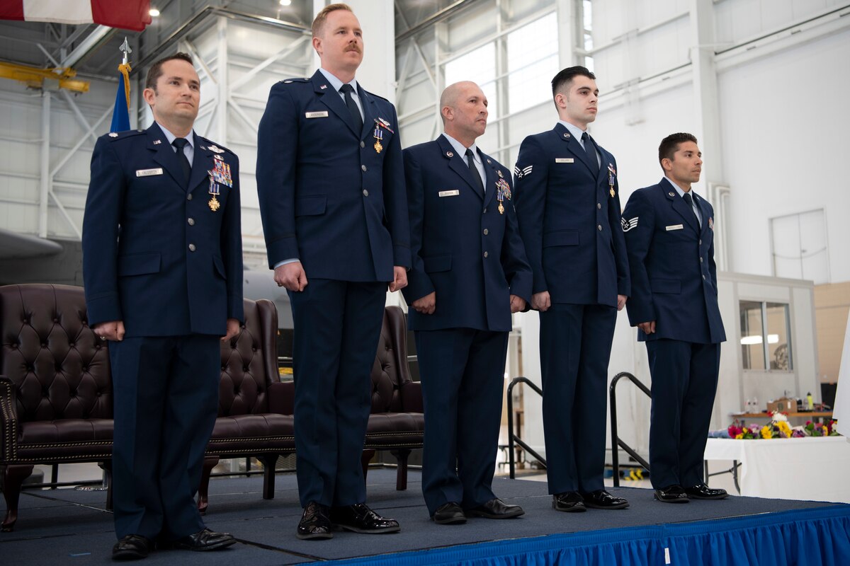The Air Force Reserve Command deputy commander awards the Distinguished Flying Cross to four C-17A Globemaster III aircrew members during a ceremony at Travis Air Force Base, Calif., Apr. 1, 2022. 
Three Reserve Citizen Airmen assigned to the 349th Air Mobility Wing at Travis, and an active duty Airman from the 3rd Wing, Joint Base Elmendorf-Richardson, Alaska, were recognized for answering their nation’s call when they helped evacuate Americans and their allies out of Afghanistan during Operation Allies Refuge in August 2021.
During the ceremony, Maj. Gen. Matthew J. Burger, the former commander of the 349th AMW, presented the medals to Lt. Col. Dominic Calderon, 1st Lt. Kyle Anderson and Master Sgt. Silva Foster, from the 301st Airlift Squadron, and Senior Airman Michael Geller of the 517th Airlift Squadron. 
(U.S. Air Force photo by Grant Okubo)