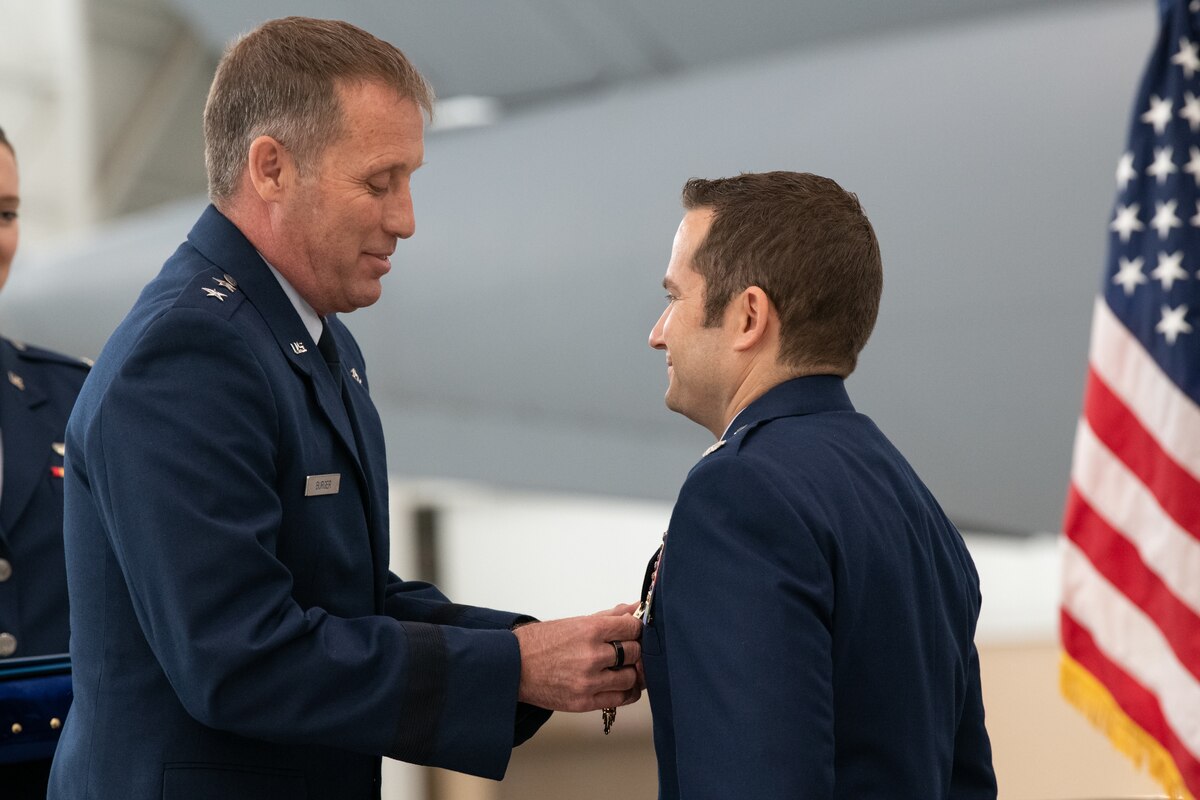 The Air Force Reserve Command deputy commander awards the Distinguished Flying Cross to four C-17A Globemaster III aircrew members during a ceremony at Travis Air Force Base, Calif., Apr. 1, 2022. 
Three Reserve Citizen Airmen assigned to the 349th Air Mobility Wing at Travis, and an active duty Airman from the 3rd Wing, Joint Base Elmendorf-Richardson, Alaska, were recognized for answering their nation’s call when they helped evacuate Americans and their allies out of Afghanistan during Operation Allies Refuge in August 2021.
During the ceremony, Maj. Gen. Matthew J. Burger, the former commander of the 349th AMW, presented the medals to Lt. Col. Dominic Calderon, 1st Lt. Kyle Anderson and Master Sgt. Silva Foster, from the 301st Airlift Squadron, and Senior Airman Michael Geller of the 517th Airlift Squadron. 
(U.S. Air Force photo by Grant Okubo)