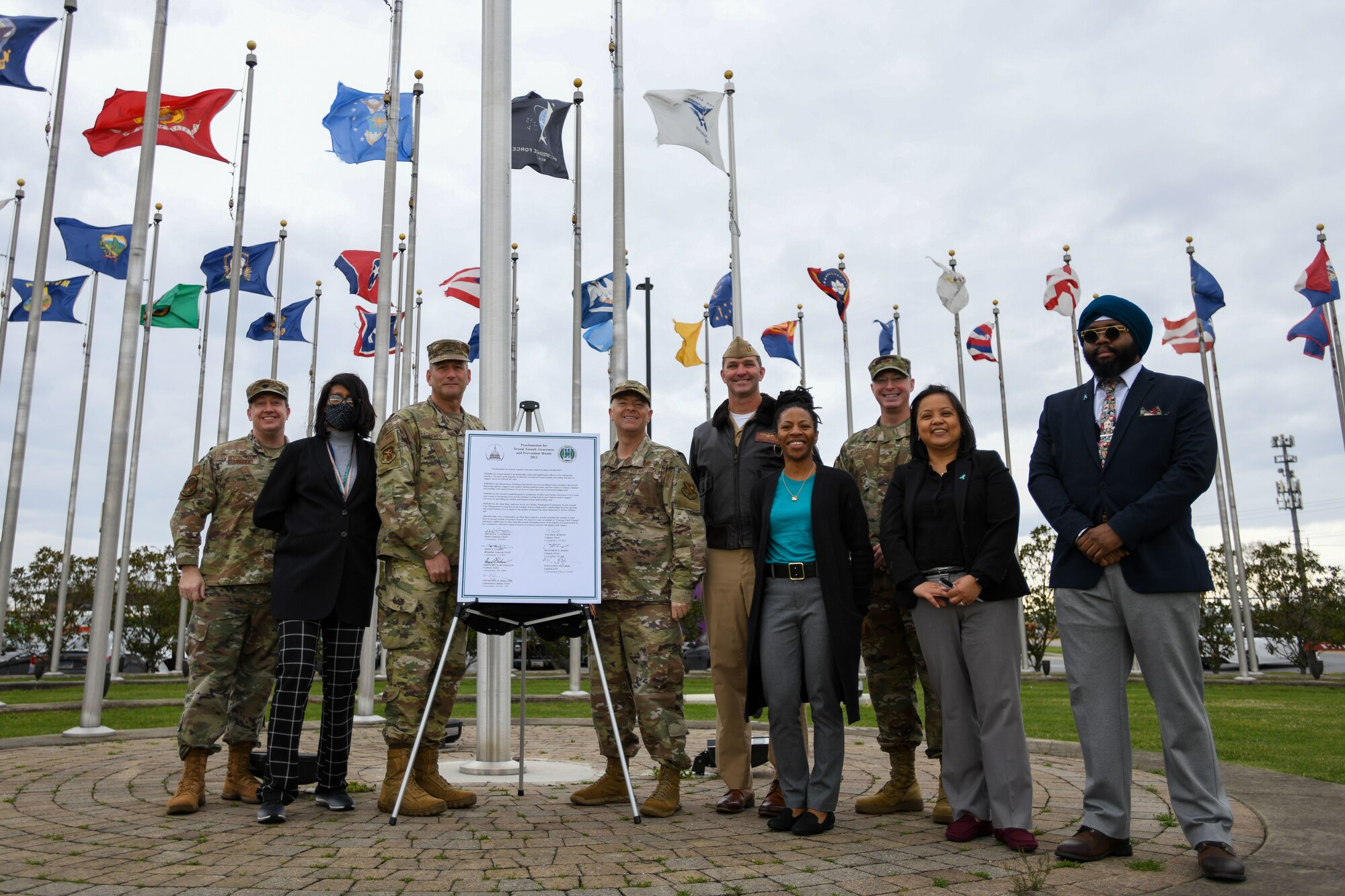 Joint Base Andrews senior leadership pose for a photo during a proclamation signing dedicated to Sexual Assault Awareness and Prevention Month, April 1, 2022, at Joint Base Andrews, Md.