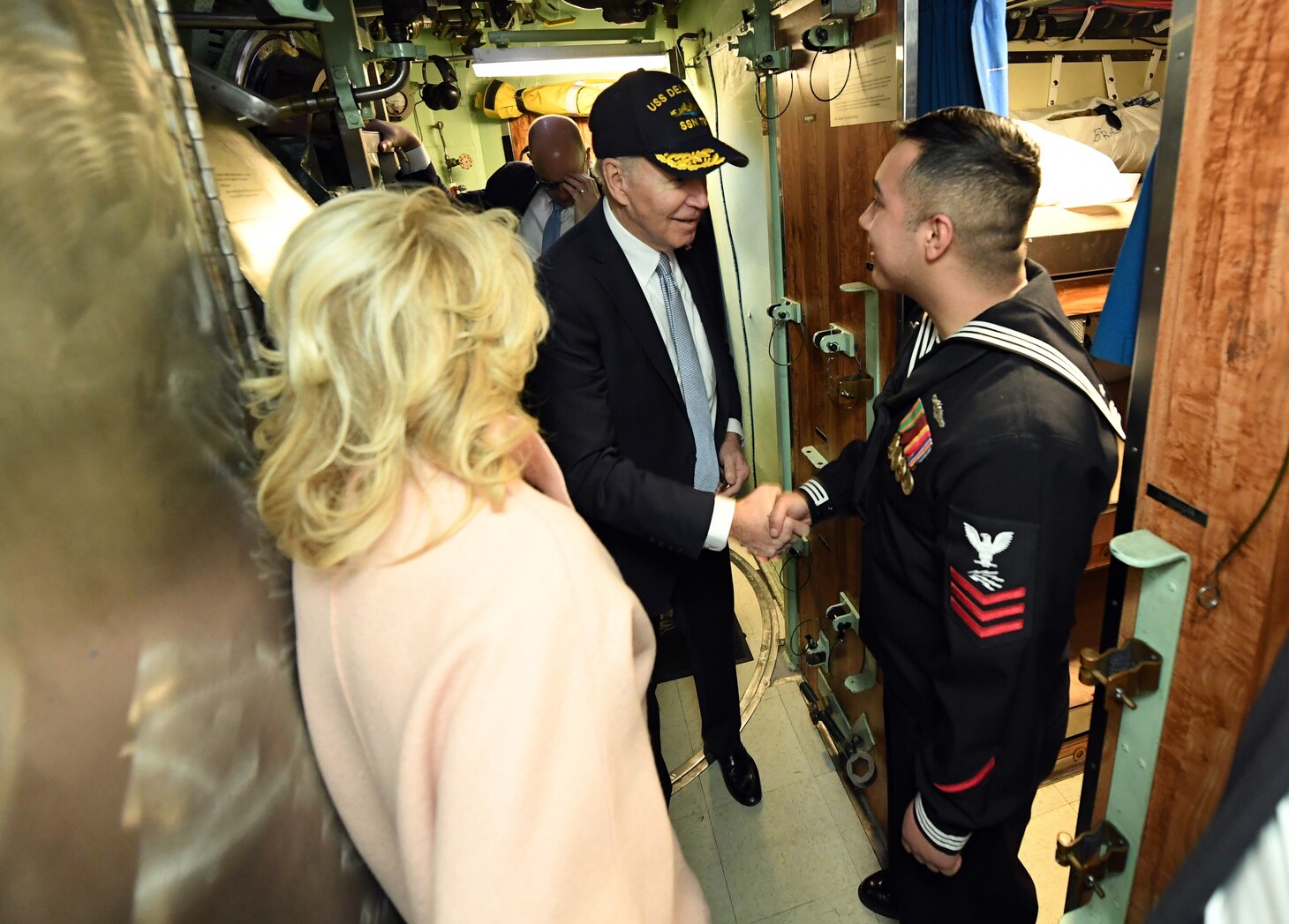 President of the United States Joe Biden and First Lady Jill Biden are greeted by Petty Officer 1st Class David Jaimeruiz following a commissioning commemoration ceremony for the Virginia-class submarine USS Delaware (SSN 791), and his family in Wilmington, Delaware April 2, 2022.