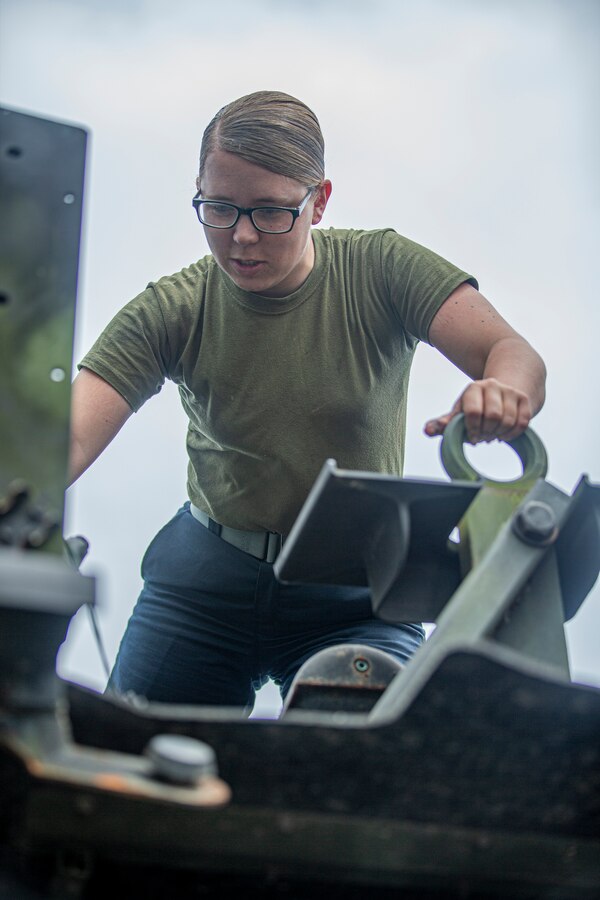 U.S. Marine Corps Cpl. Madeline Prine, an automotive maintenance technician with 7th Communication Battalion, III Marine Expeditionary Force Information Group, operates on a 7-ton truck on Camp Hansen, Okinawa, Japan, March 25, 2022. Prine is a certified scuba instructor through the Professional Association of Diving Instructors. (U.S. Marine Corps photo by Cpl. Alex Fairchild)