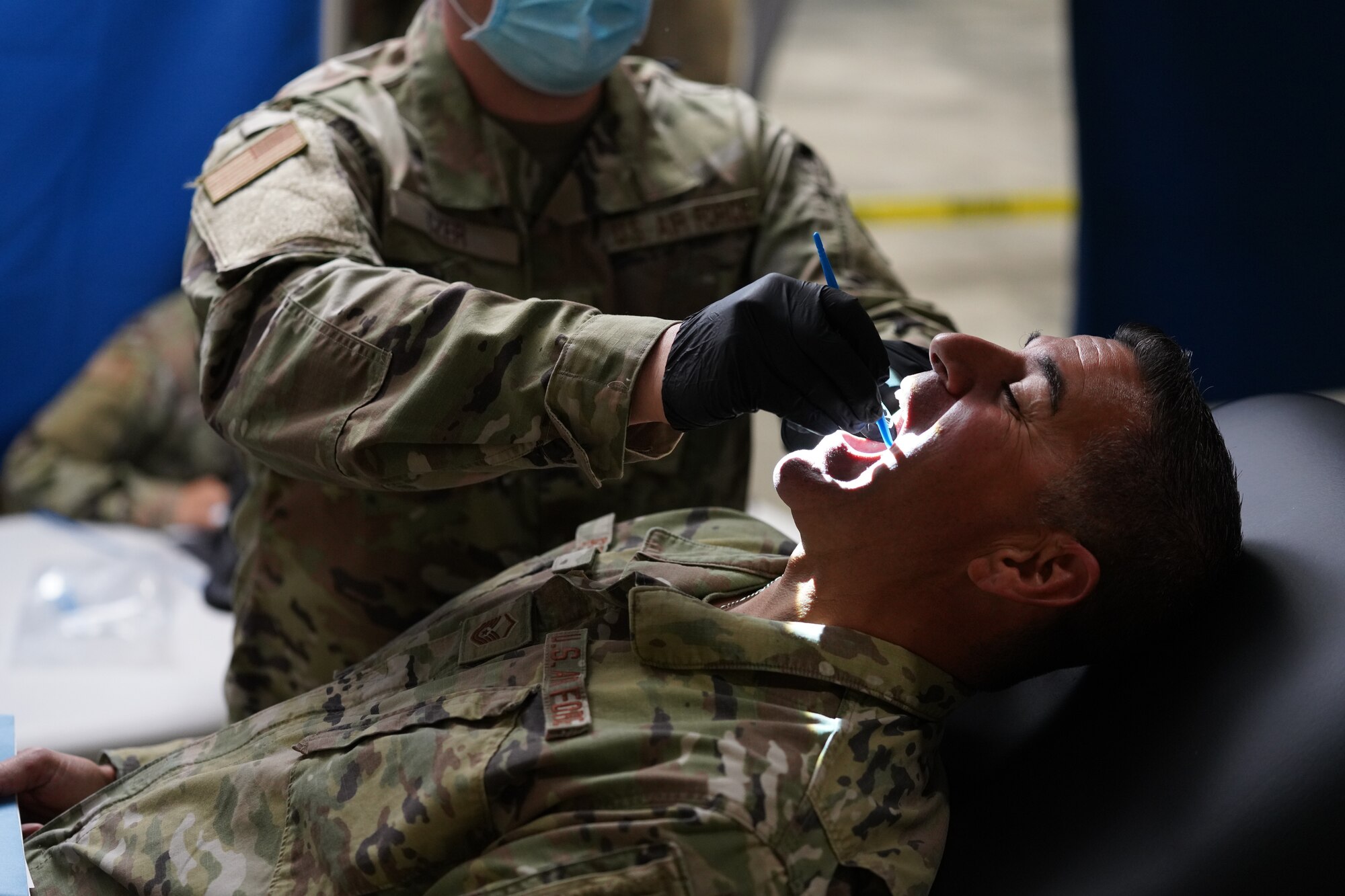 California Air National Guard Master Sgt. Tony Perez of the 146th Security Forces Squadron has his teeth examined by Maj. Luke Czer, a dentist with the 146th Medical Group, at the PHAG2R (Periodic Health Assessment Go 2 Ready) at Channel Islands Air National Guard Station (CIANGS), Port Hueneme, California. November 6, 2021. This two-day event is the first annual PHAG2R for CIANGS. It's objective is to increase efficiency for airmen to complete their medical requirements, maintaining readiness for the whole year in a one-stop shop.
