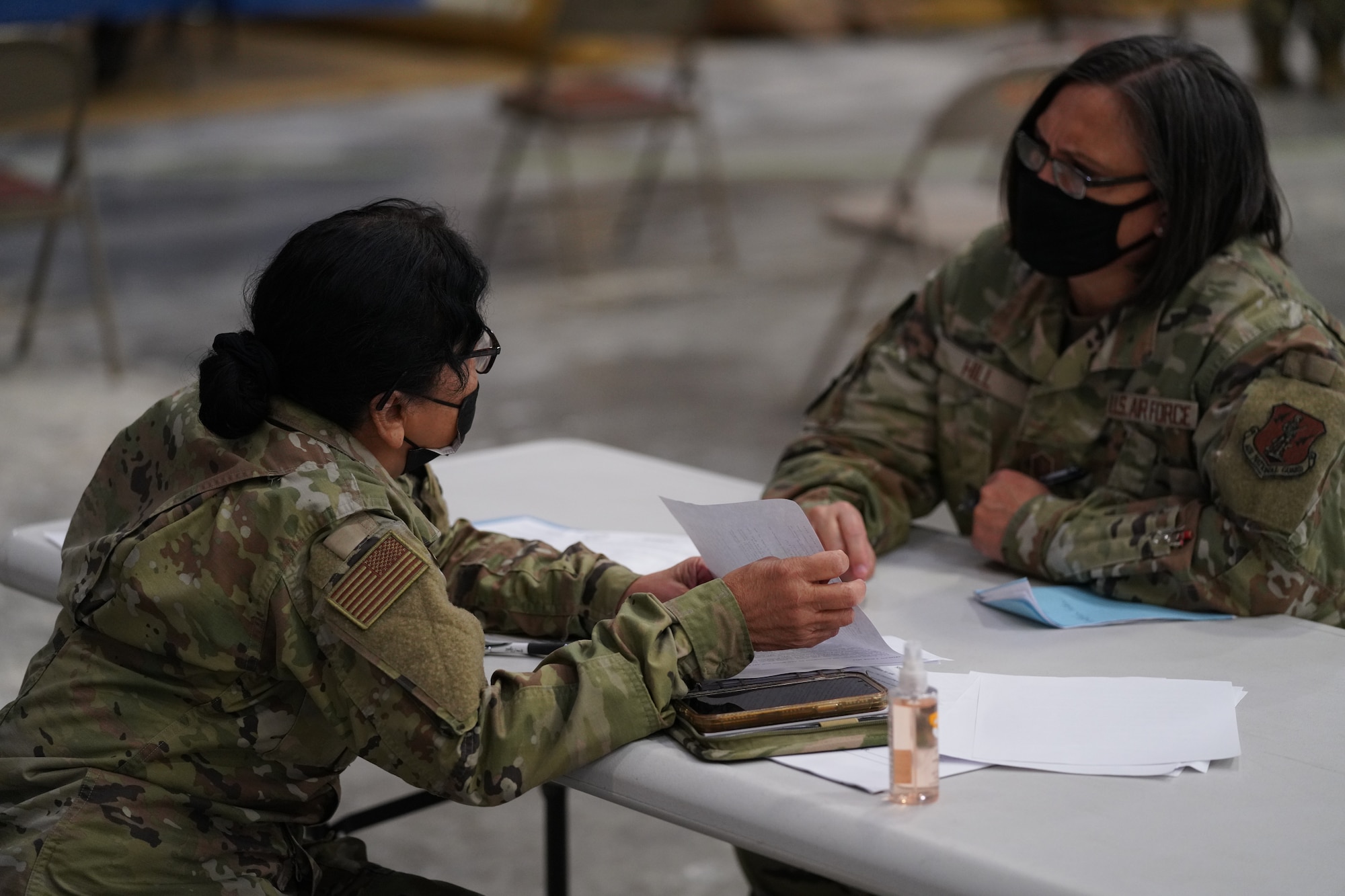 California Air National Guard Lt. Col. Sylvia Vedder, from the 146th Medical Group meets with Master Sgt. Tonda Hill, from the 195th Wing at the PHAG2R (Periodic Health Assessment Go 2 Ready) at Channel Islands Air National Guard Station (CIANGS), Port Hueneme, California. November 6, 2021. This two-day event is the first annual PHAG2R for CIANGS. It's objective is to increase efficiency for airmen to complete their medical requirements, maintaining readiness for the whole year in a one-stop shop.