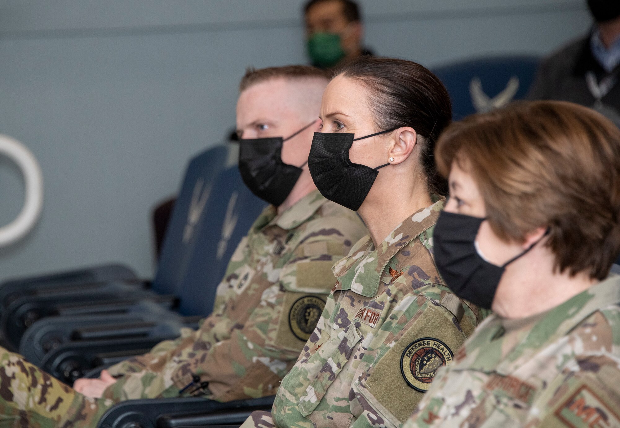 From left to right, U.S. Air Force Master Sgt. Matthew Maxwell, Defense Health Agency senior enlisted leader, Brig. Gen. Anita Fligge, DHA chief nursing officer, and Col. Jane Free, 60th Medical Group chief nurse, attend the David Grant USAF Medical Center safety huddle at Travis Air Force Base, California, March 31, 2022. During a DGMC tour, Fligge interacted with medical staff while touring multiple facilities. (U.S. Air Force photo by Heide Couch)