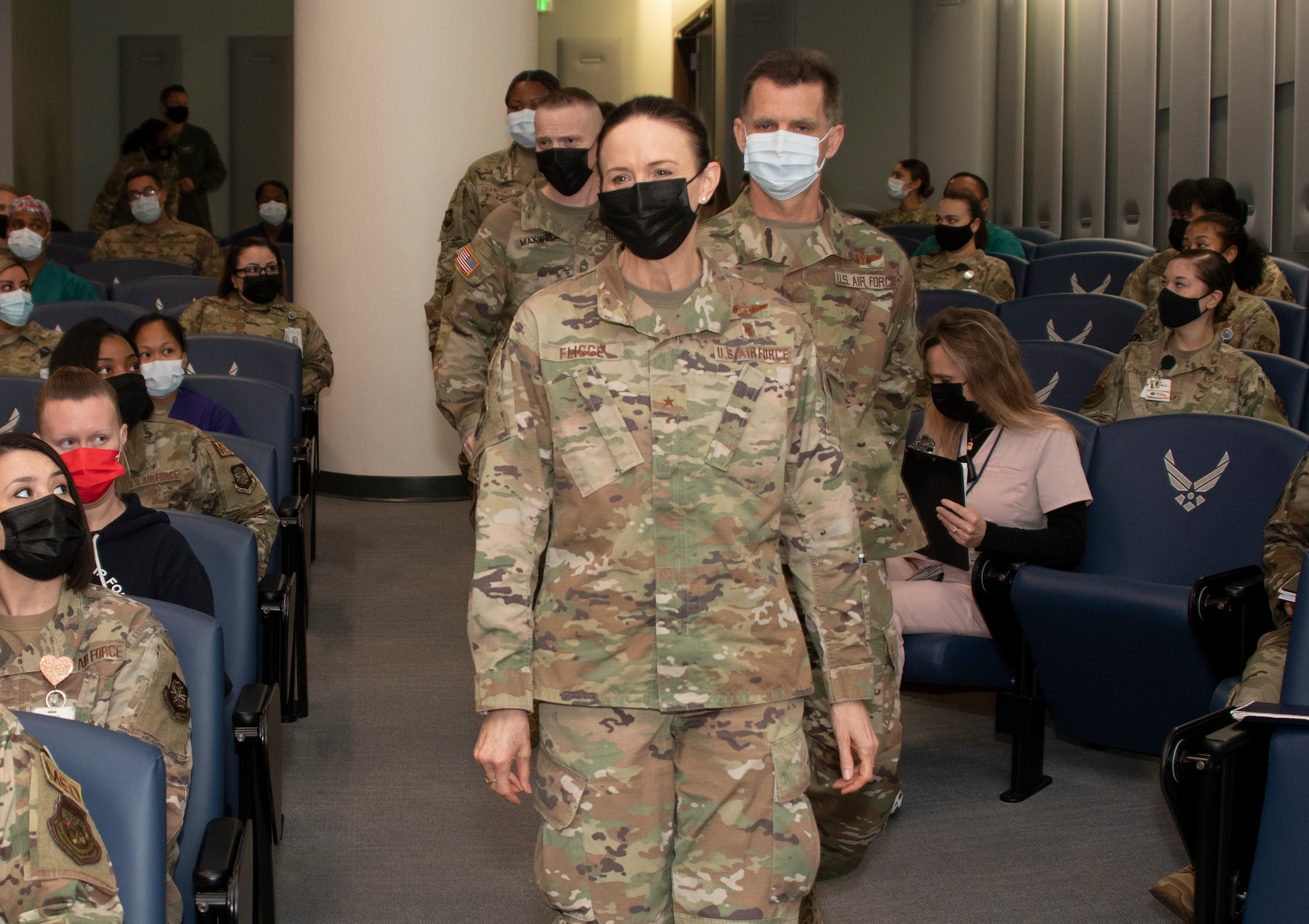 U.S. Air Force Brig. Gen. Anita Fligge, Defense Health Agency chief nursing officer, arrives at the David Grant USAF Medical Center safety huddle at Travis Air Force Base, California, March 31, 2022. During a DGMC tour, Fligge interacted with medical staff while touring multiple facilities. (U.S. Air Force photo by Heide Couch)