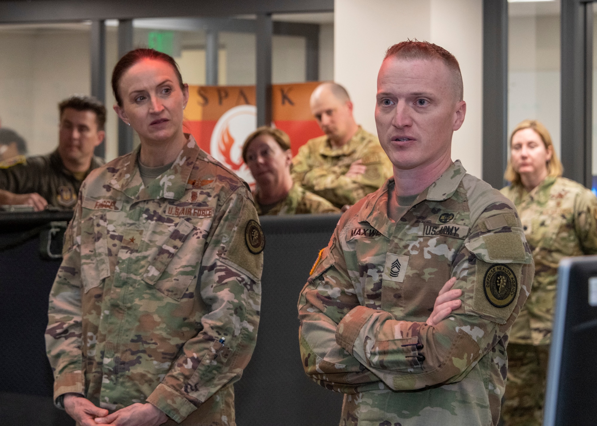 U.S. Air Force Brig. Gen. Anita Fligge, left, Defense Health Agency chief nursing officer, and Master Sgt. Matthew Maxwell, DHA senior enlisted leader, tour the Phoenix Spark Lab at Travis Air Force Base, California, March 31, 2022. Fligge and Maxwell were briefed on the innovative Phoenix Spark Lab functions. (U.S. Air Force photo by Heide Couch)