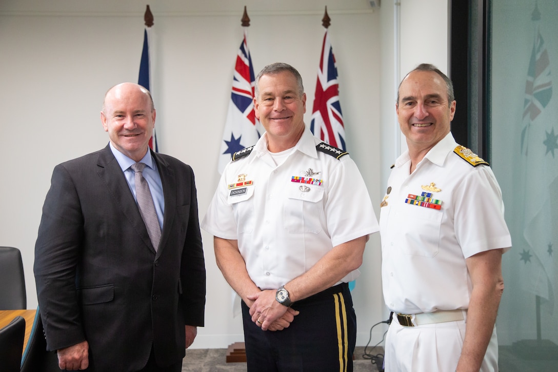 U.S. Space Command commander, U.S. Army Gen. James Dickinson (center), poses with Australia’s Mr. Greg Moriarty, Defense Secretary (left) and Vice Admiral David Jonston, Vice Chief of Defence Force (right), during a meeting in Canberra March 22, 2022. Dickinson visited Australia March 20-26, 2022, to reaffirm the importance of space cooperation between the United States and Australia.