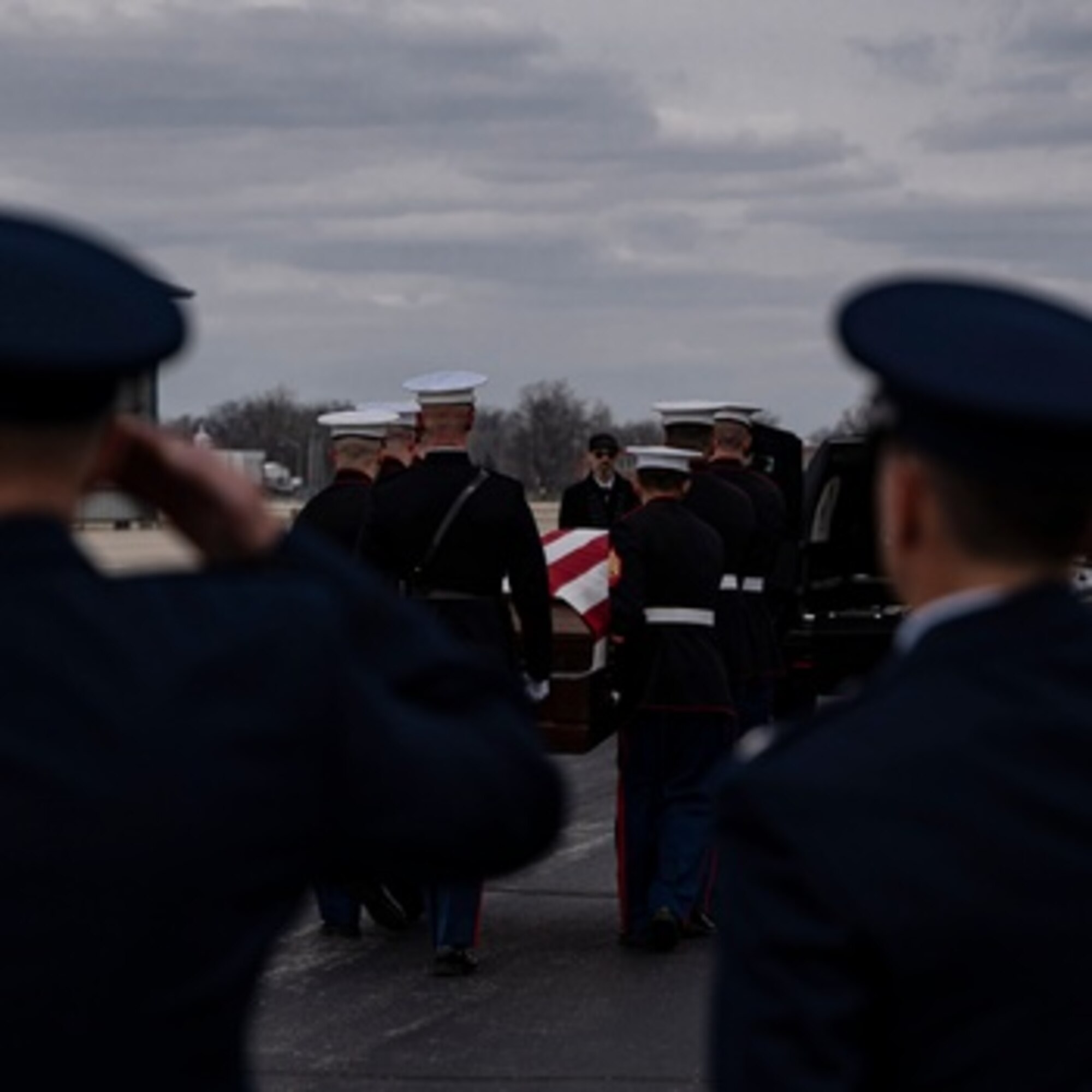 Marines from Detachment 1, Communications Company, Combat Logistics Regiment 45, 4th Marine Logistics Group, transfer the remains of U.S. Marine Corps Capt. Matthew J. Tomkiewicz of Fort Wayne, Indiana, April 2, 2022. Tomkiewicz was one of four U.S. Marines killed March 18, 2022, during a training flight near Bodo, Norway during Exercise Cold Response 2022. (U.S. Air Force photo/Douglas Hays)