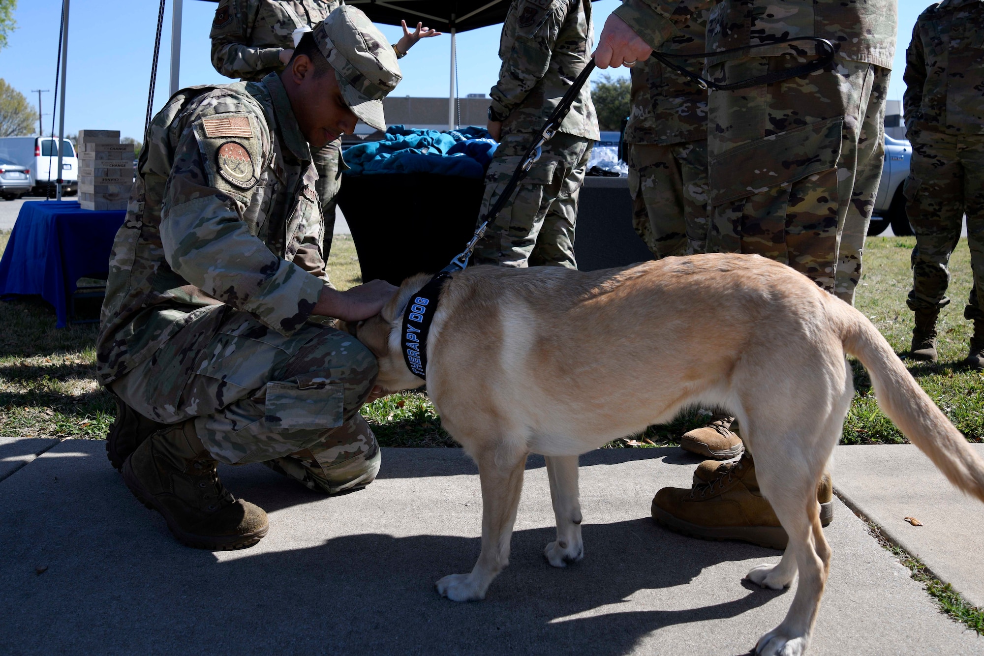 Senior Airman Dhruv Singh, 301 st Fighter Wing Religious Affairs Airman pets

Dallas, 301 FW therapy dog, during the Sexual Assault Prevention and Response meet and greet at Naval Air Station Joint Reserve Base Fort Worth, Texas, April 2, 2022. The 301 FW Helping Agencies team acquired Dallas to promote stress relief.