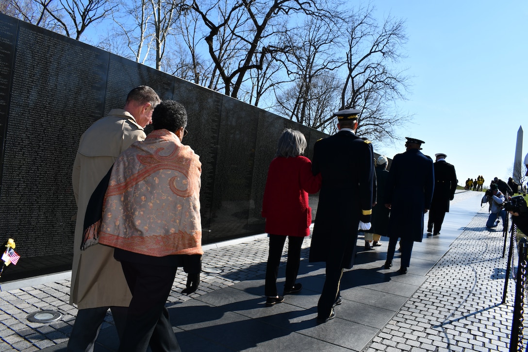 Ms. Fern Sumpter Winbush, Defense POW/MIA Accounting Agency Principal Deputy Director, and Vietnam Veteran and Gold Star brother Col. Al Shine leave a ceremony at the Vietnam War Memorial on National Vietnam Veterans Day, March 29, 2022 in Washington, DC. Since 1973, the remains of more than 1,000 Americans killed during the Vietnam War have been identified and returned to their families for burial with full military honors. The Agency vigorously pursues the fullest possible accounting for 1,584 missing American personnel from the war to include civilians. (Defense Department photo by Ashley M. Wright)