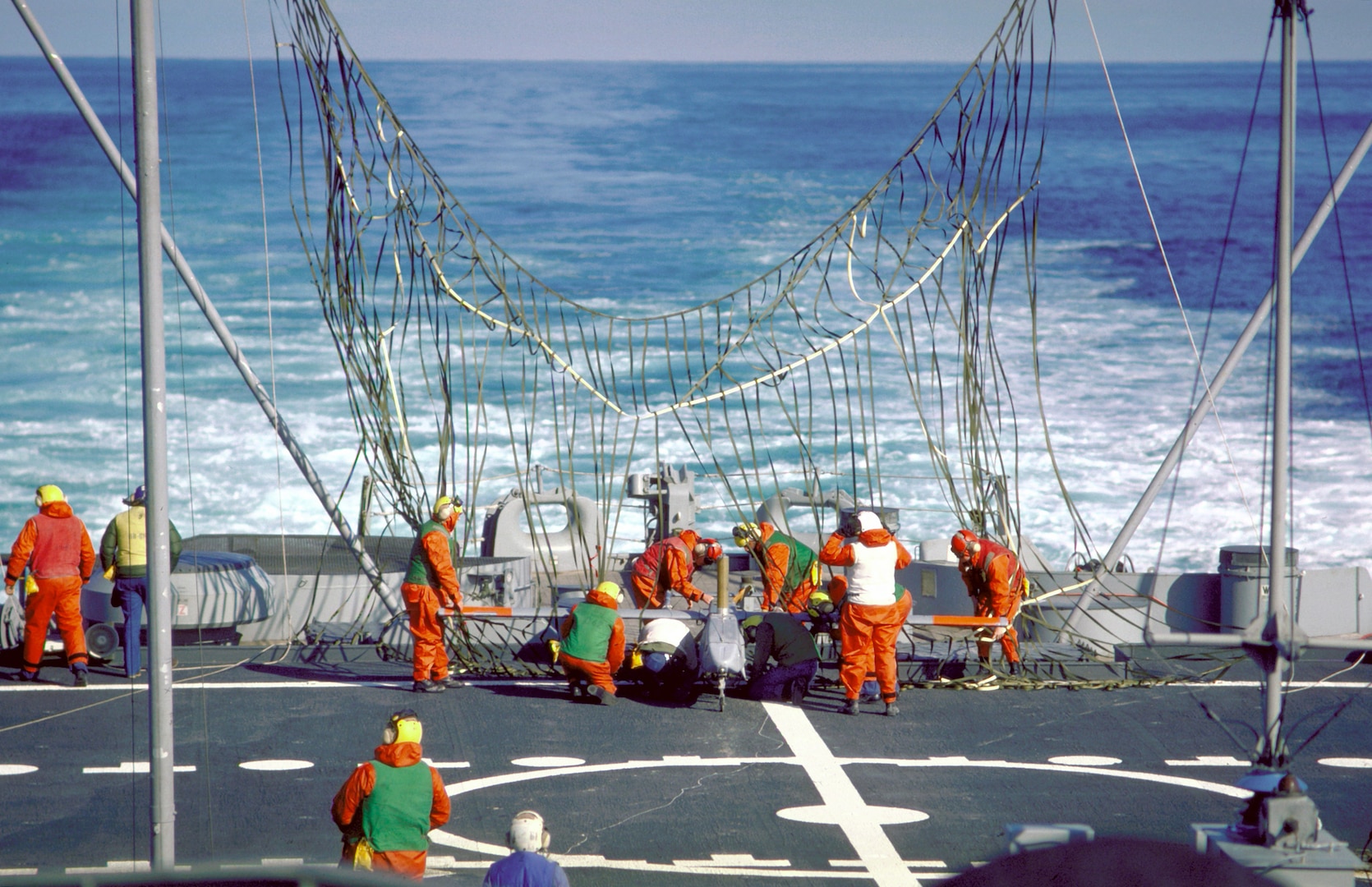 Crewmen disengage a Pioneer I remotely-piloted vehicle (RPV) from a recovery net erected on the stern of the battleship USS IOWA (BB-61) on 1 Nov 1986 (Photo by: PHC Jeff Hilton, USN)