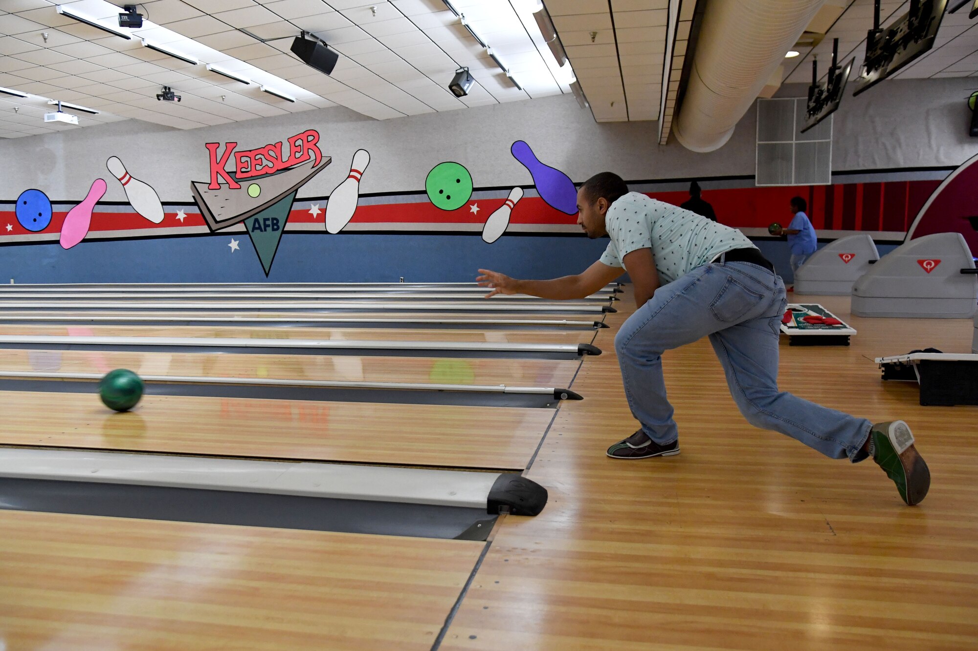 U.S. Air Force Senior Airman Isaiah Harper, 81st Operations Support Flight air traffic control tower operator, bowls during the Strike Out Sexual Assault Bowling Tournament inside Gaude Lanes at Keesler Air Force Base, Mississippi, April 1, 2022. The event was held in awareness of Sexual Assault and Awareness Prevention Month which is recognized throughout April. (U.S. Air Force photo by Kemberly Groue)