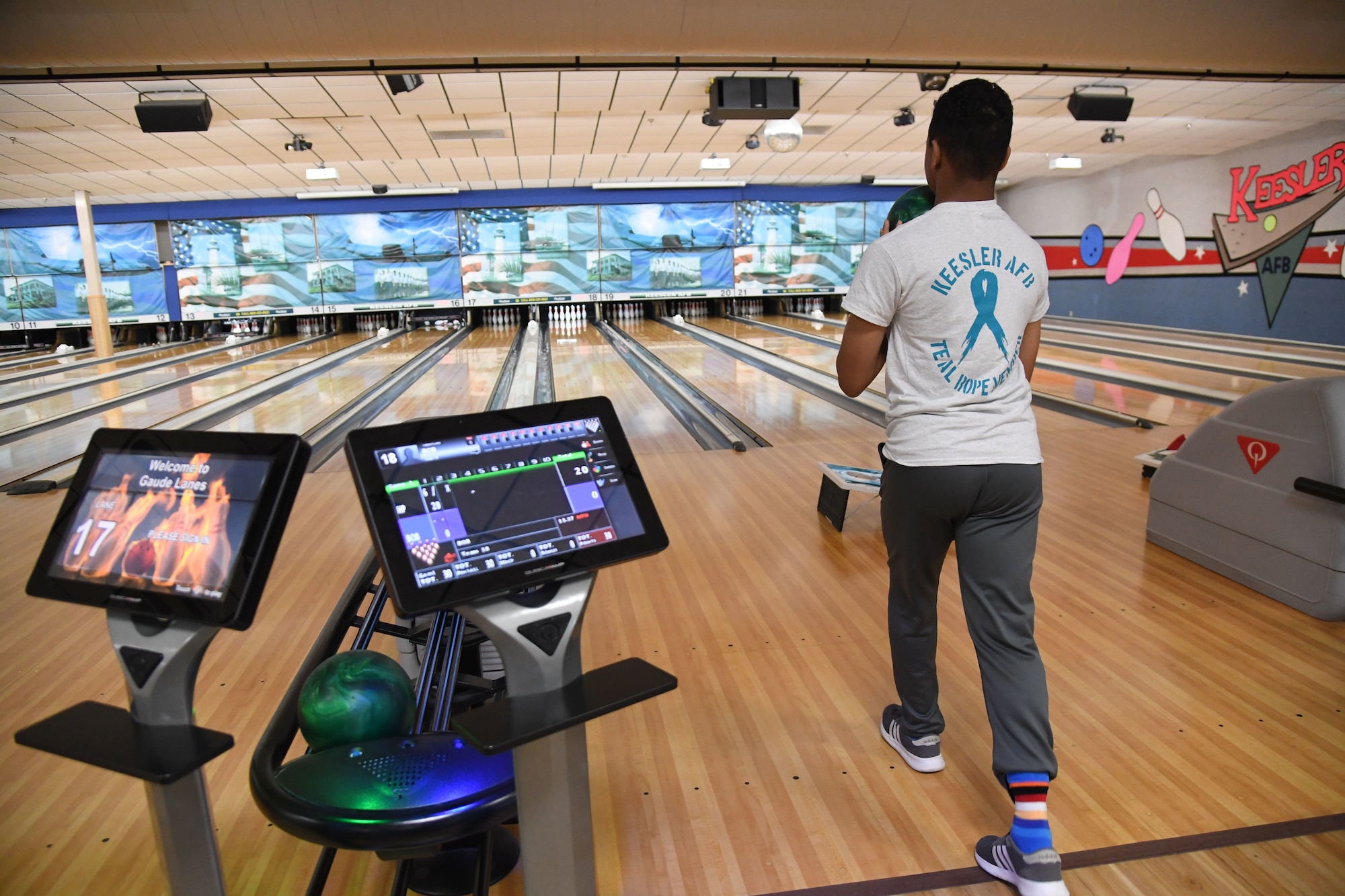 U.S. Air Force Airman Xavier Williams, 338th Training Squadron student, bowls during the Strike Out Sexual Assault Bowling Tournament inside Gaude Lanes at Keesler Air Force Base, Mississippi, April 1, 2022. The event was held in awareness of Sexual Assault and Awareness Prevention Month which is recognized throughout April. (U.S. Air Force photo by Kemberly Groue)