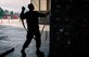 Senior Airman Jesus Lopez-Rios, an aerial porter for the 305th Aerial Port Squadron, throws a net fastener over a cargo pallet during Readiness Exercise 2022 on Joint Base McGuire-Dix-Lakehurst, April 1, 2022. Readiness exercises demonstrate Air Mobility wings are ready to provide operationally ready, deliberately developed and professionally led Airmen to deploy and support operations in contested environments.