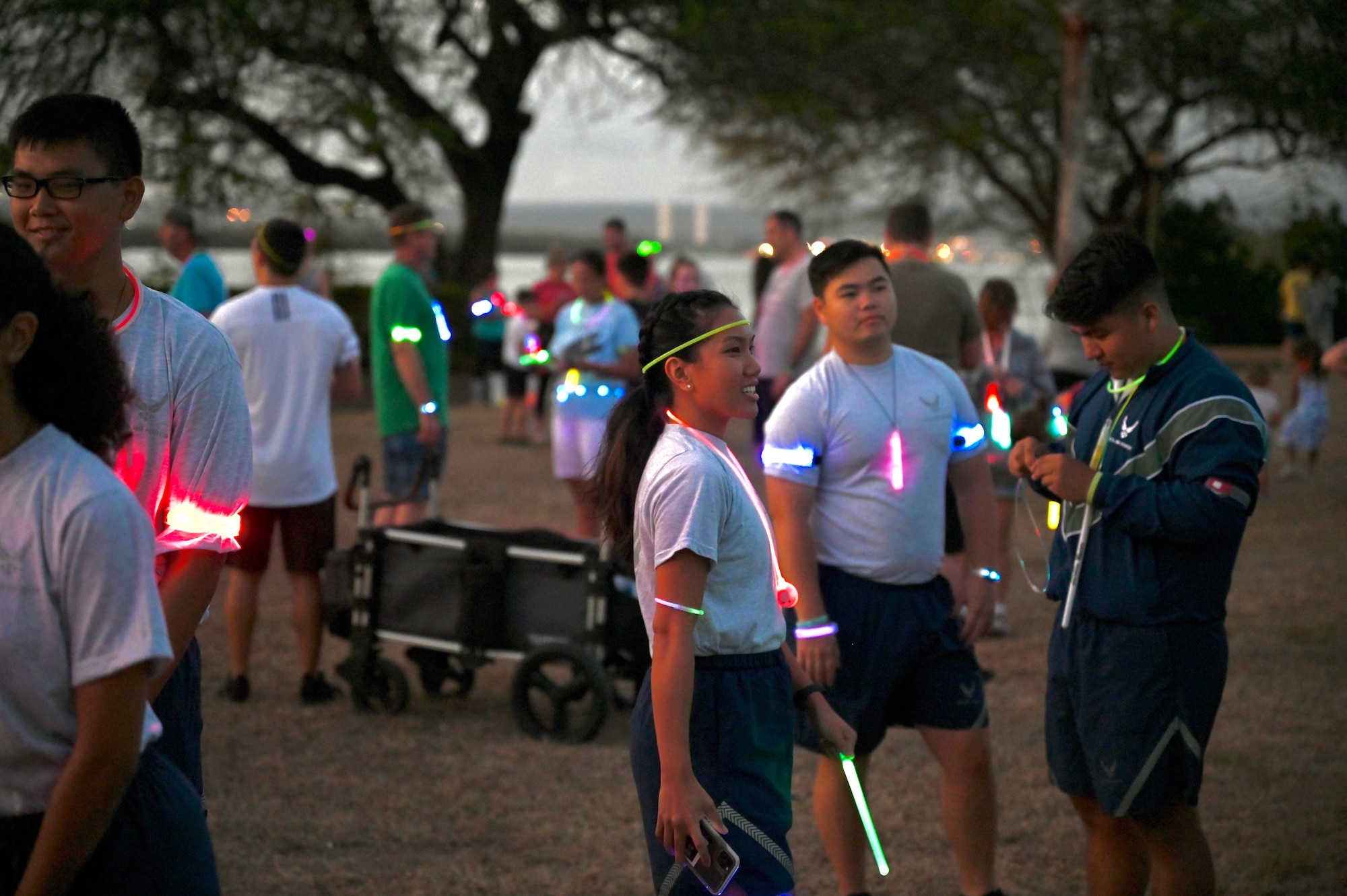 Members from the University of Hawaii at Manoa Air Force Reserve Officer Training Corps prepare to run during the Sexual Assault Awareness and Prevention Month glow run at Joint Base Pearl Harbor-Hickam, Hawaii, April 1, 2022. Cadets and cadre members participated in the 5k run around the Hickam-side of JBPHH to help raise awareness for sexual assault and resources for victims in the military. (U.S. Air Force photo by 1st Lt. Benjamin Aronson)