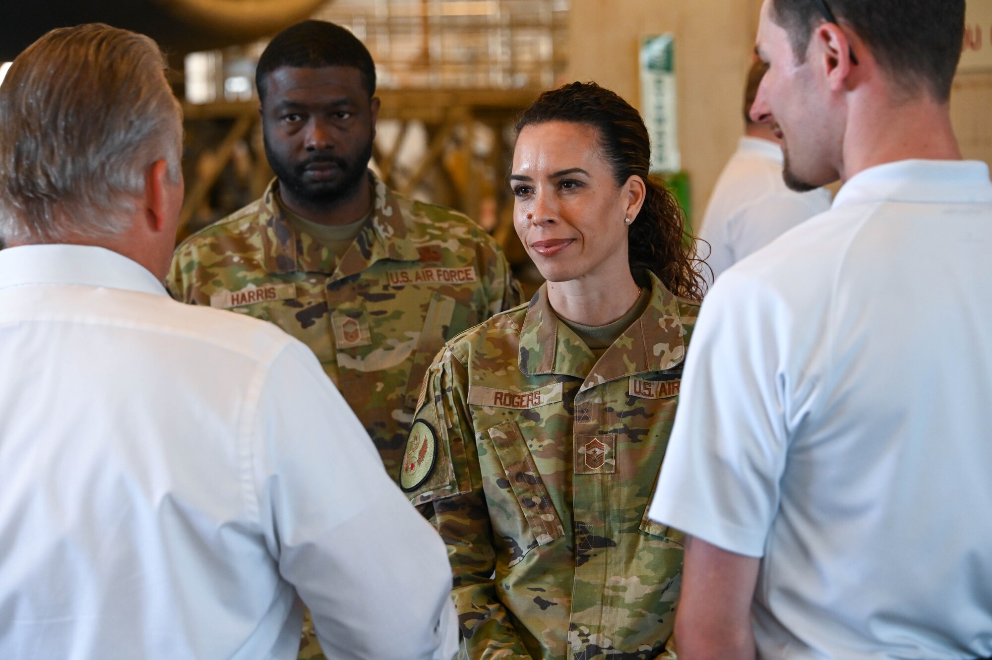 U.S. Air Force Chief Master Sgt. Kristina Rogers, 19th Air Force command chief, listens to a brief from 97th Maintenance Group (MXG) members at Altus Air Force Base (AAFB), Oklahoma, March 31, 2022. The 97th MXG maintainers briefed Rogers on the A-Team’s role at AAFB before showing her the maintenance process of a C-17 Globemaster III. (U.S. Air Force photo by Senior Airman Kayla Christenson)