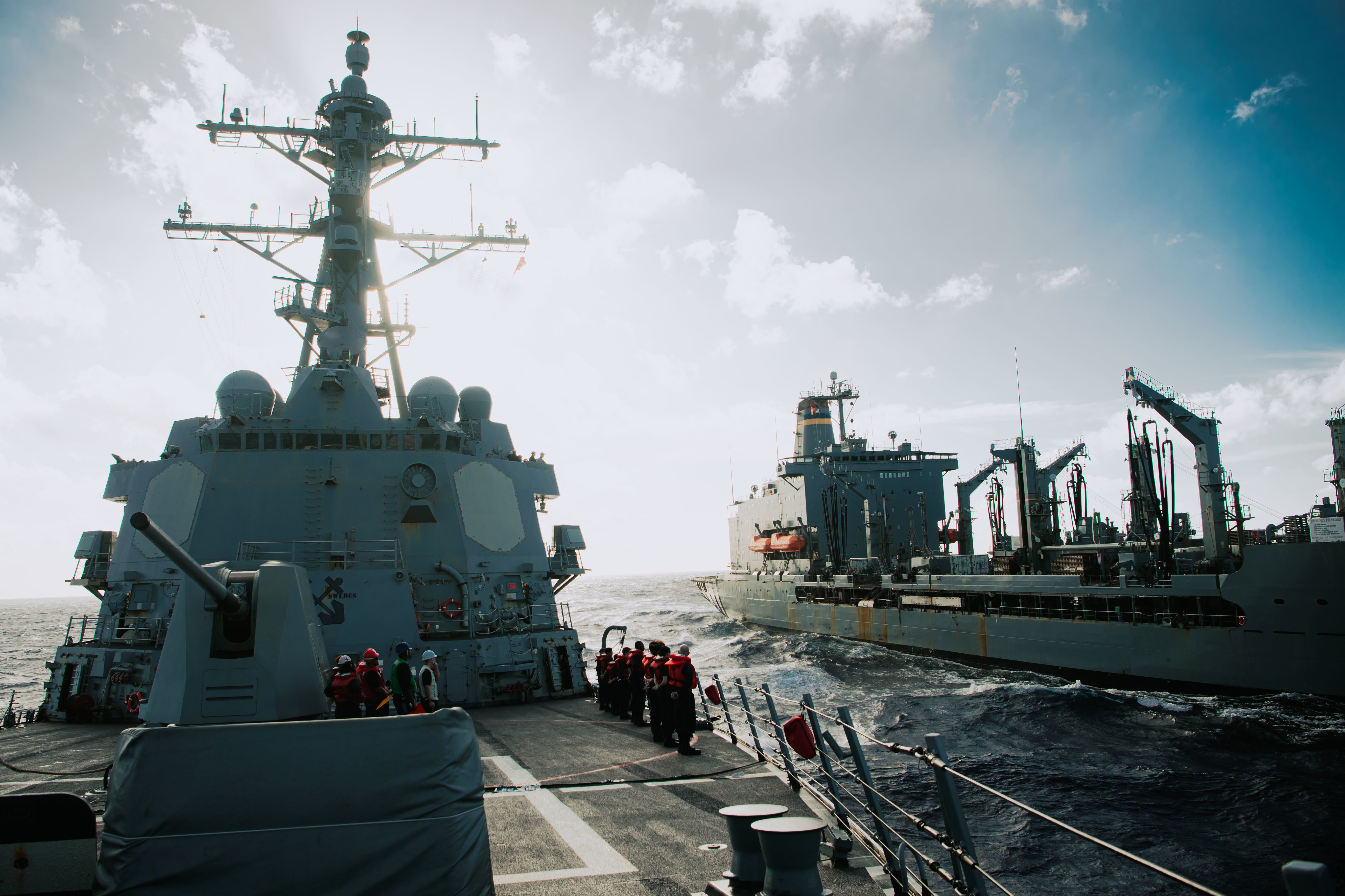 The Arleigh Burke-class guided-missile destroyer USS Momsen (DDG 92) conducts a replenishment-at-sea with the fleet replenishment oiler USNS Guadalupe (T-AO 200), March 30, 2022.