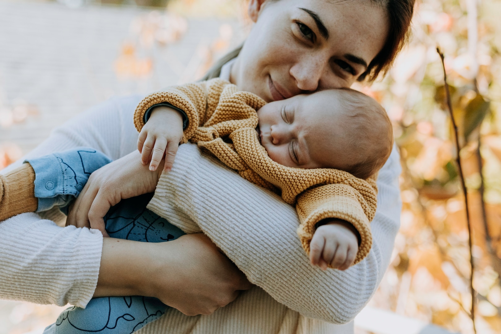 Mom holds sleeping baby