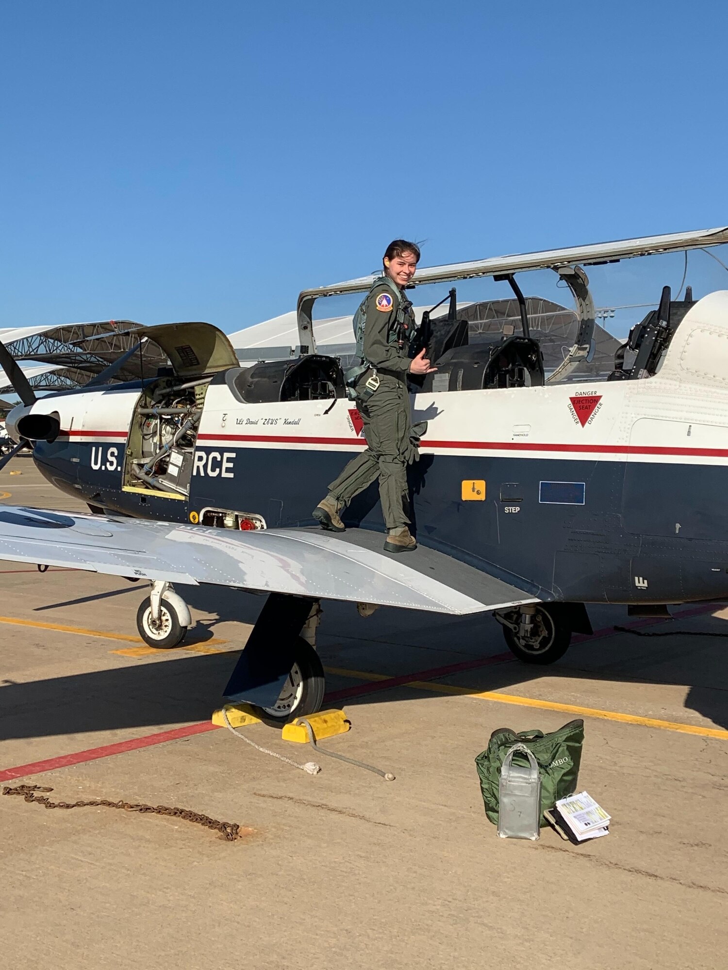 A pilot inspects a jet.