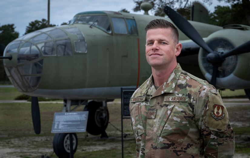 An airman poses for a photo.