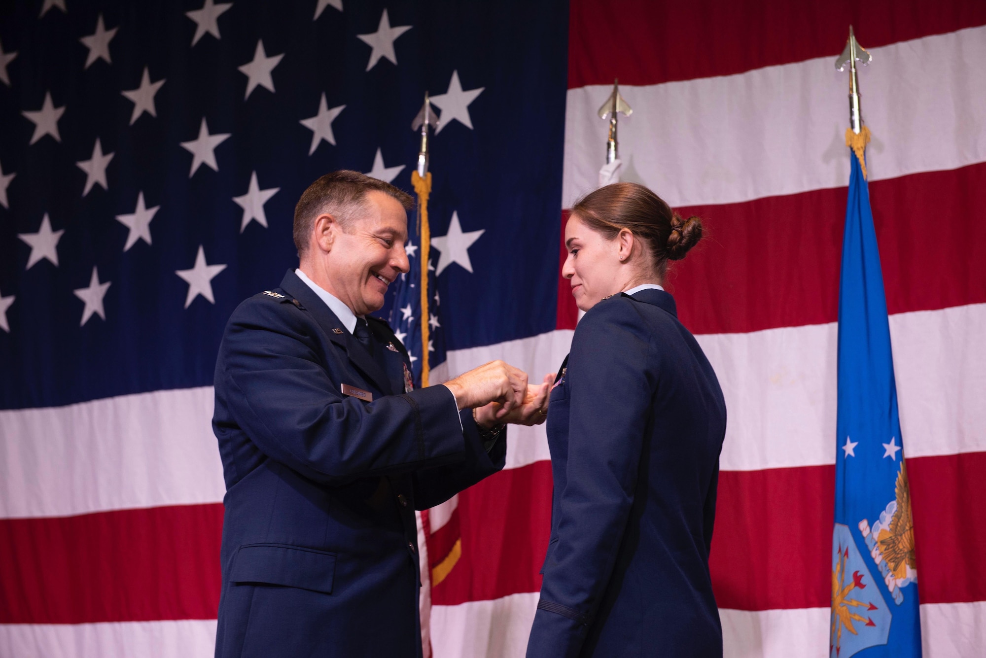A pilot receives her aviation wings.