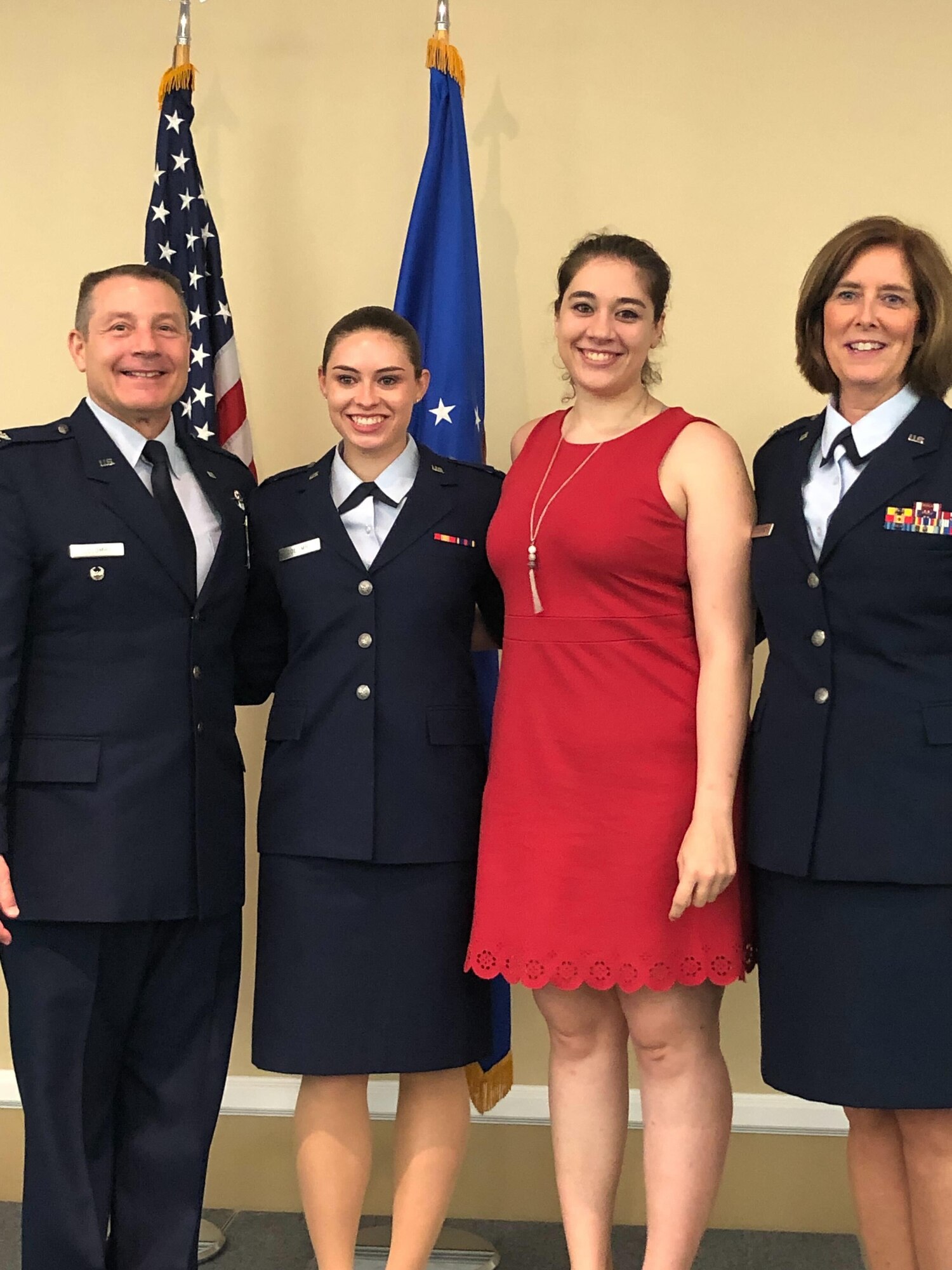 A pilot poses with her family.